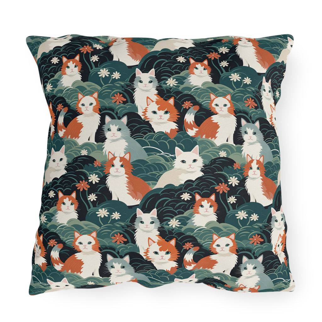 Outdoor Pillow - A whimsical, fluffy, watercolor depiction of various cats of different colors peeking out from a dense dark blue and green bush with white flowers.