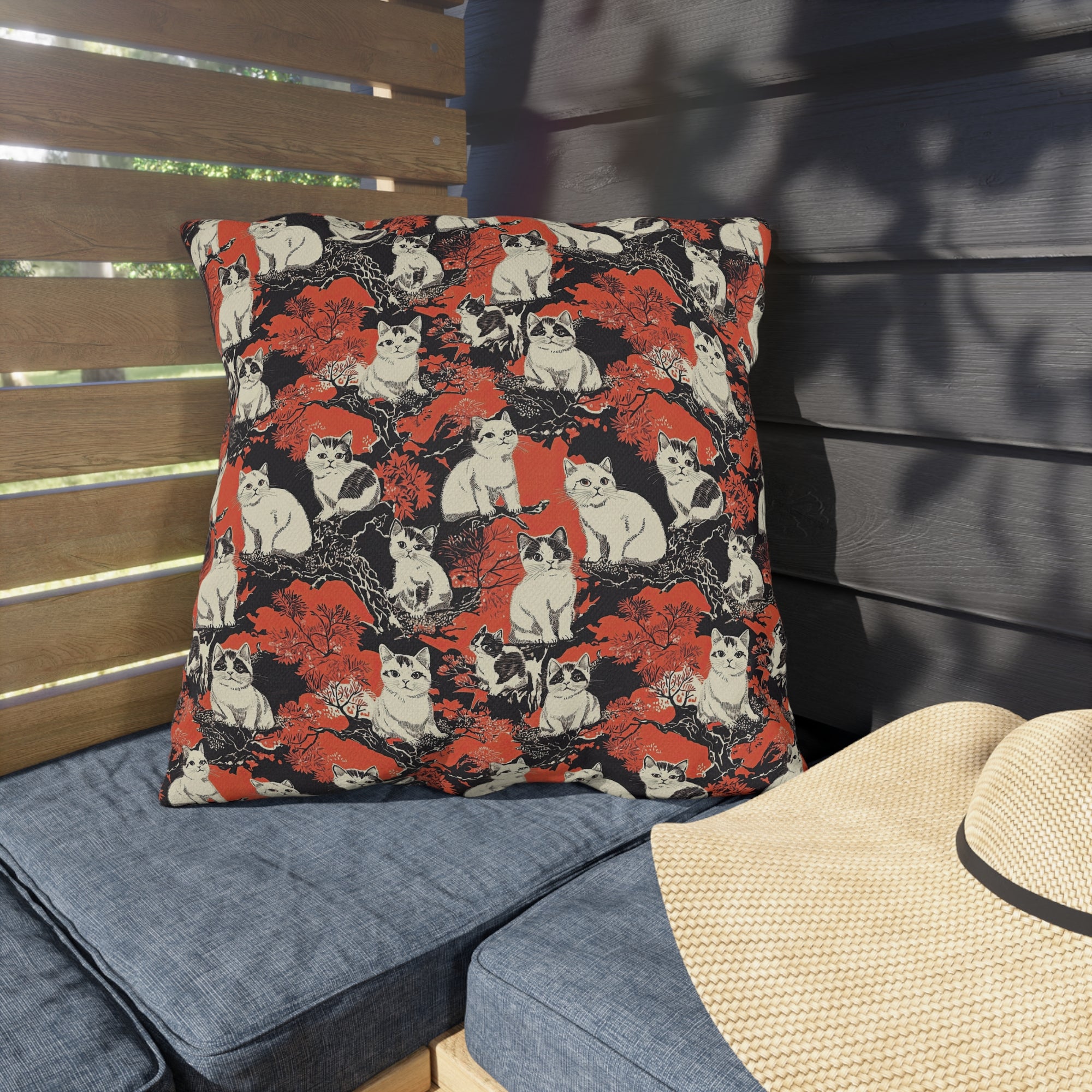Outdoor Pillow - A striking black-and-white illustration with red accents of charming cats perched on the branches of trees in a beautiful Japanese woodblock print style.
