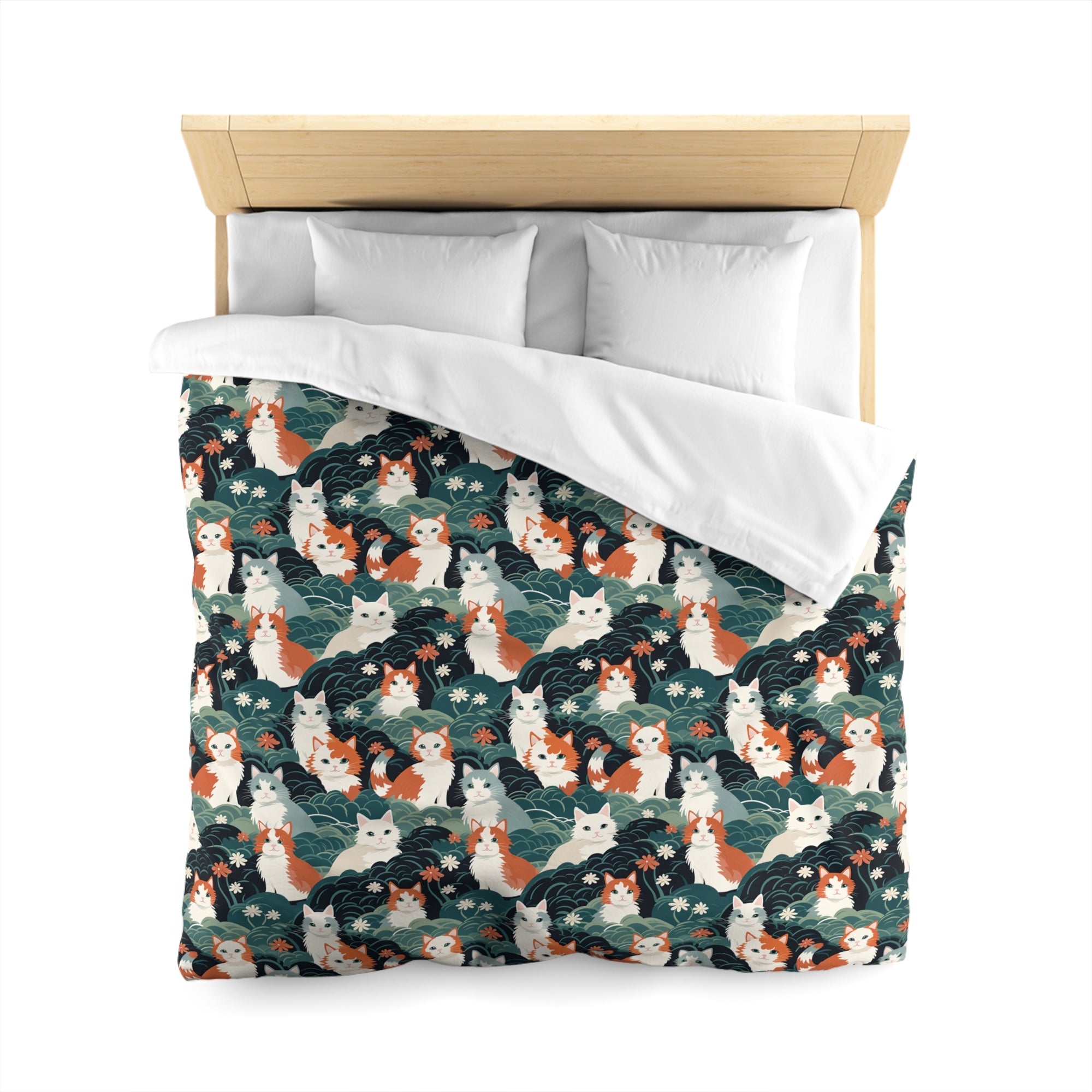 Duvet Cover - A whimsical, fluffy, watercolor depiction of various cats of different colors peeking out from a dense dark blue and green bush with white flowers.