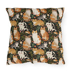 Outdoor Pillow - Whimsical cat and kitten garden party, various cat breeds amidst green foliage and pink flowers, charming animal illustration, dark forest green background, playful and natural art