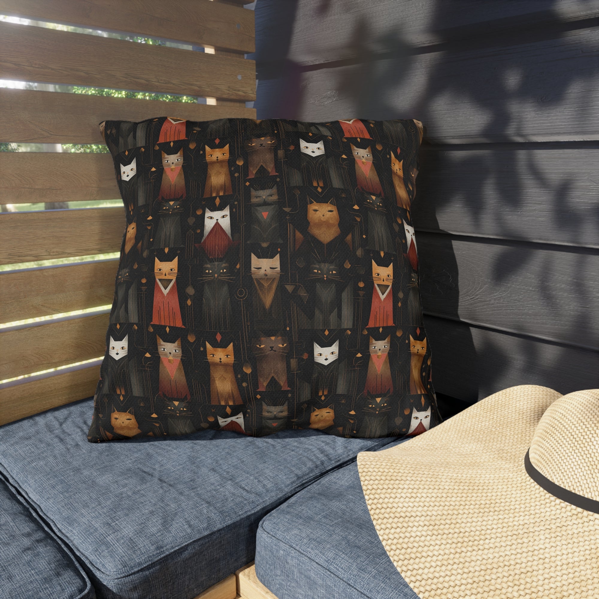 Outdoor Pillow - A striking and sophisticated Art Deco-style pattern of felines with bold, intricate lines and dramatic geometric shapes, all rendered in a unique gold and gray color palette.