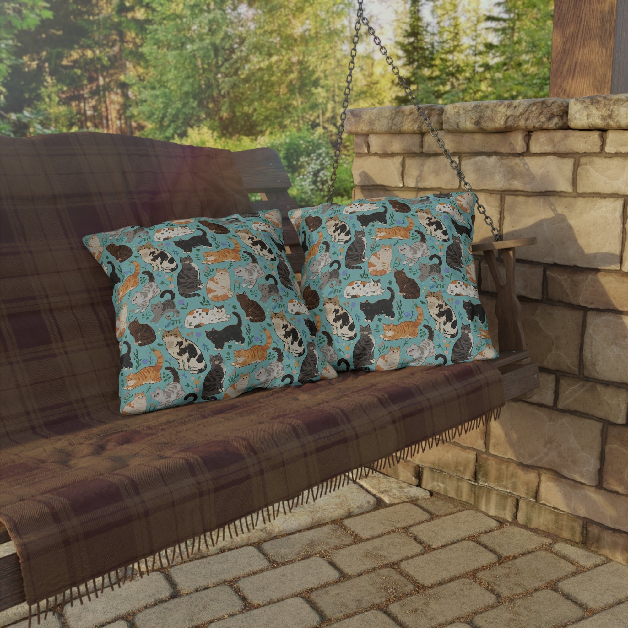 Outdoor Pillow - A Delightful Assortment of Charming Cats in Diverse Poses and Breeds Scattered Across a Soft Blue Floral Background