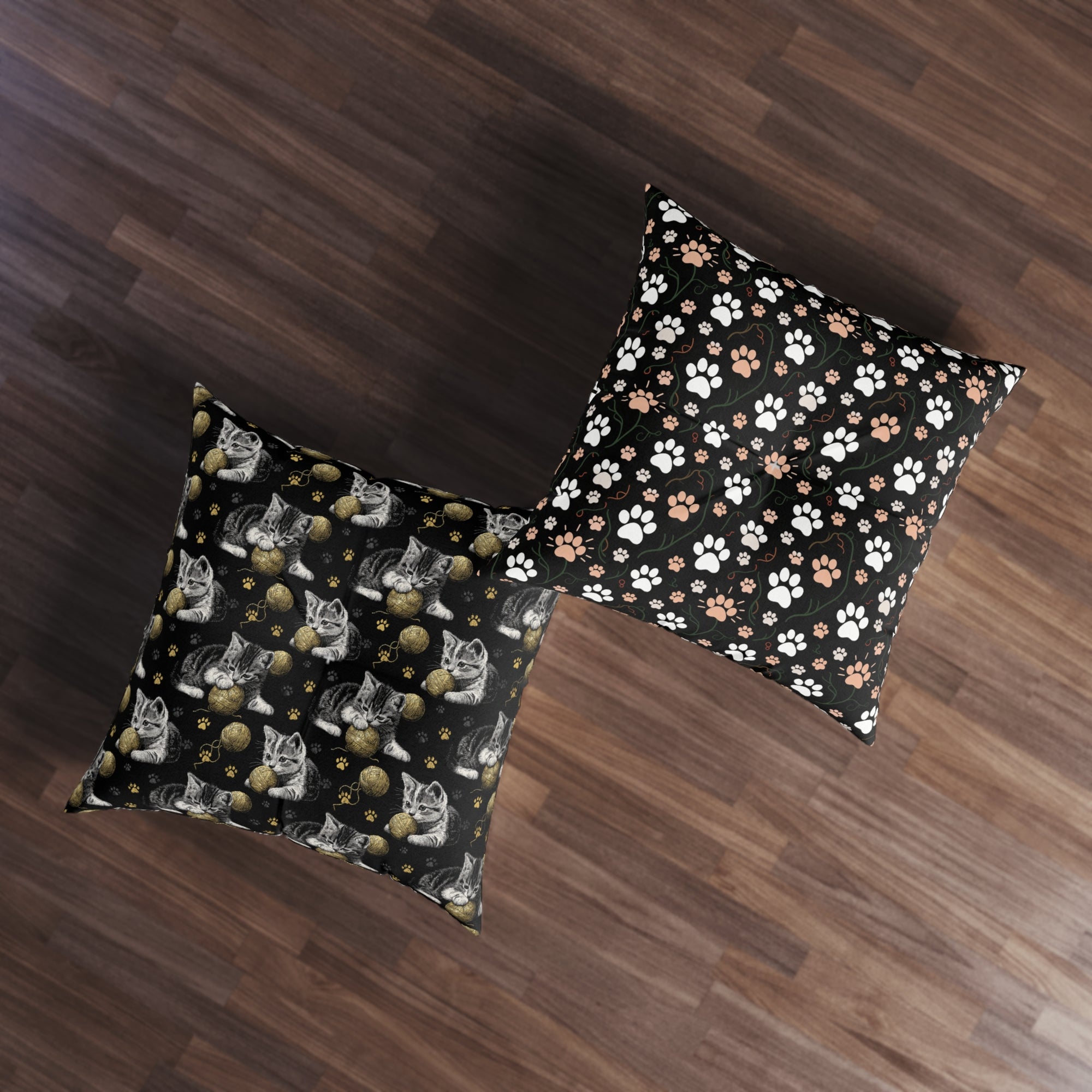 Indoor Square Floor Pillow - Grey and White Kittens Playing with Golden Yarn on a Black Background with Paw Prints