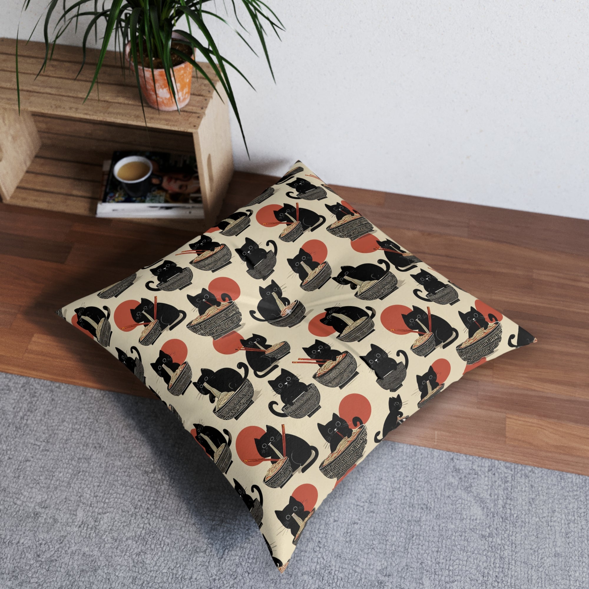 Indoor Square Floor Pillow - A whimsical and delightful hand-drawn style pattern of adorable black cats eating bowls of delicious ramen noodles with a large red sun in the background.