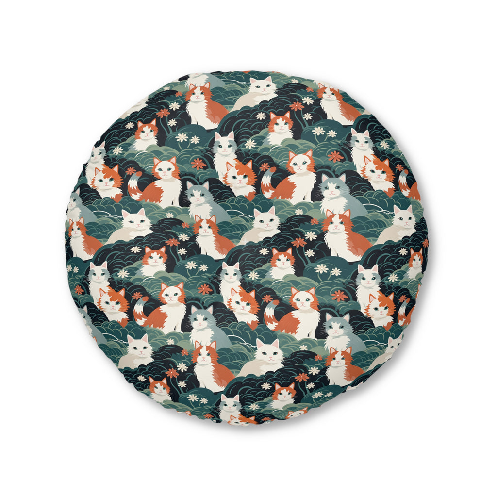 Indoor Round Floor Pillow - A whimsical, fluffy, watercolor depiction of various cats of different colors peeking out from a dense dark blue and green bush with white flowers.