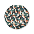 Indoor Round Floor Pillow - A whimsical, fluffy, watercolor depiction of various cats of different colors peeking out from a dense dark blue and green bush with white flowers.