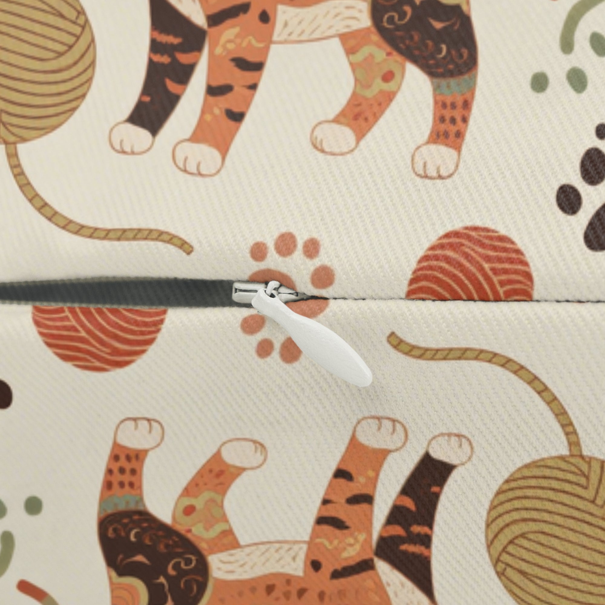 Indoor Lumbar Pillow - Artistic patterned cats in warm earth tones, unique tribal and folk art designs, playful felines with yarn and paw prints, bohemian animal print, cream background, creative cat art