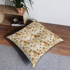 Indoor Square Floor Pillow - Adorable ginger cat with bright green eyes, sparkling gold yarn and paw prints, classic tabby cat illustration, cream background, cute and charming pet themed art
