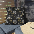 Outdoor Pillow - Grey and White Kittens Playing with Golden Yarn on a Black Background with Paw Prints