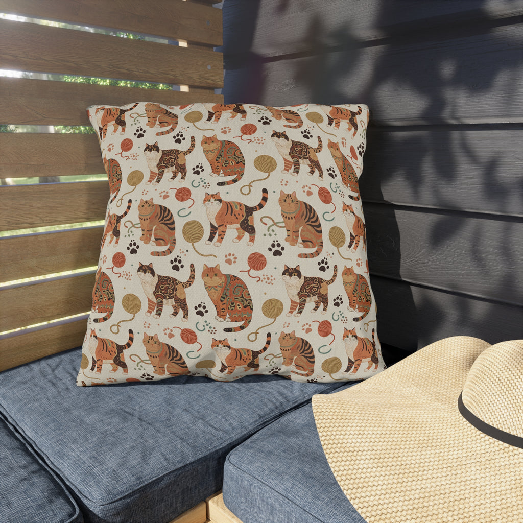 Outdoor Pillow - Artistic patterned cats in warm earth tones, unique tribal and folk art designs, playful felines with yarn and paw prints, bohemian animal print, cream background, creative cat art