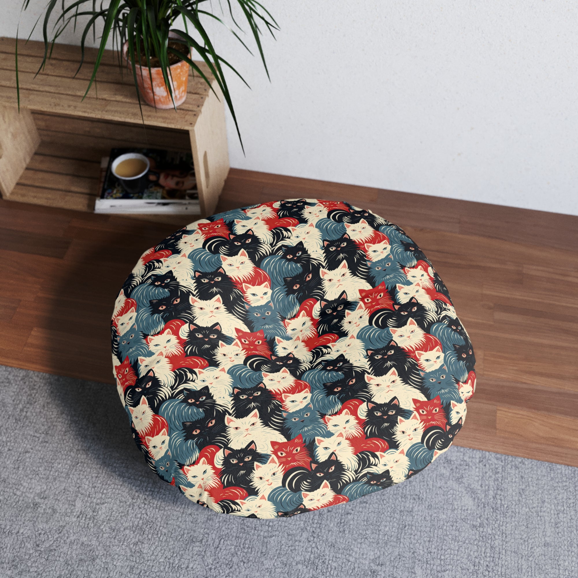 Indoor Round Floor Pillow - A bold and graphic pop art style illustration featuring a tight-knit cluster of various fluffy felines in black, white, red, and blue.