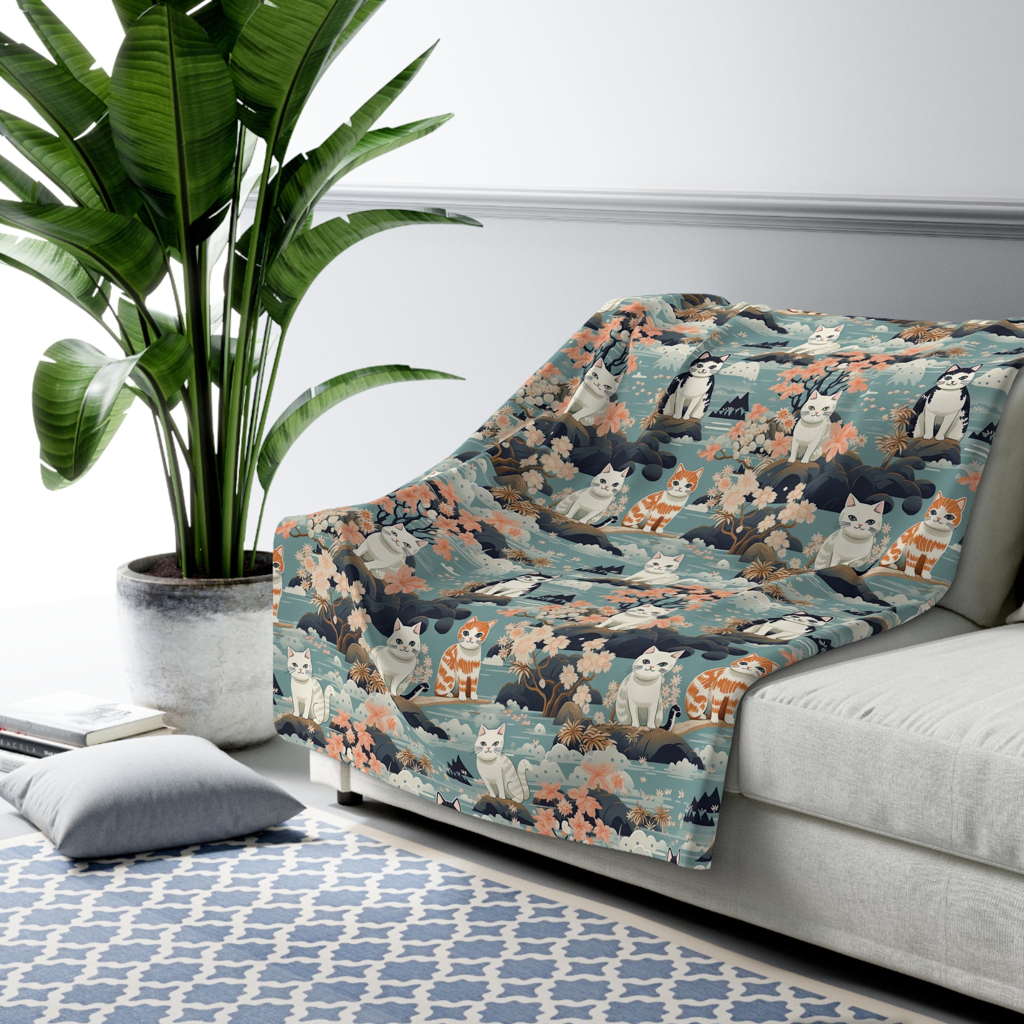 Sherpa Blanket - A serene watercolor painting of fluffy cats lounging on rocks, surrounded by cherry blossoms and blue water, in a tranquil, nature-filled, Japanese-inspired landscape.