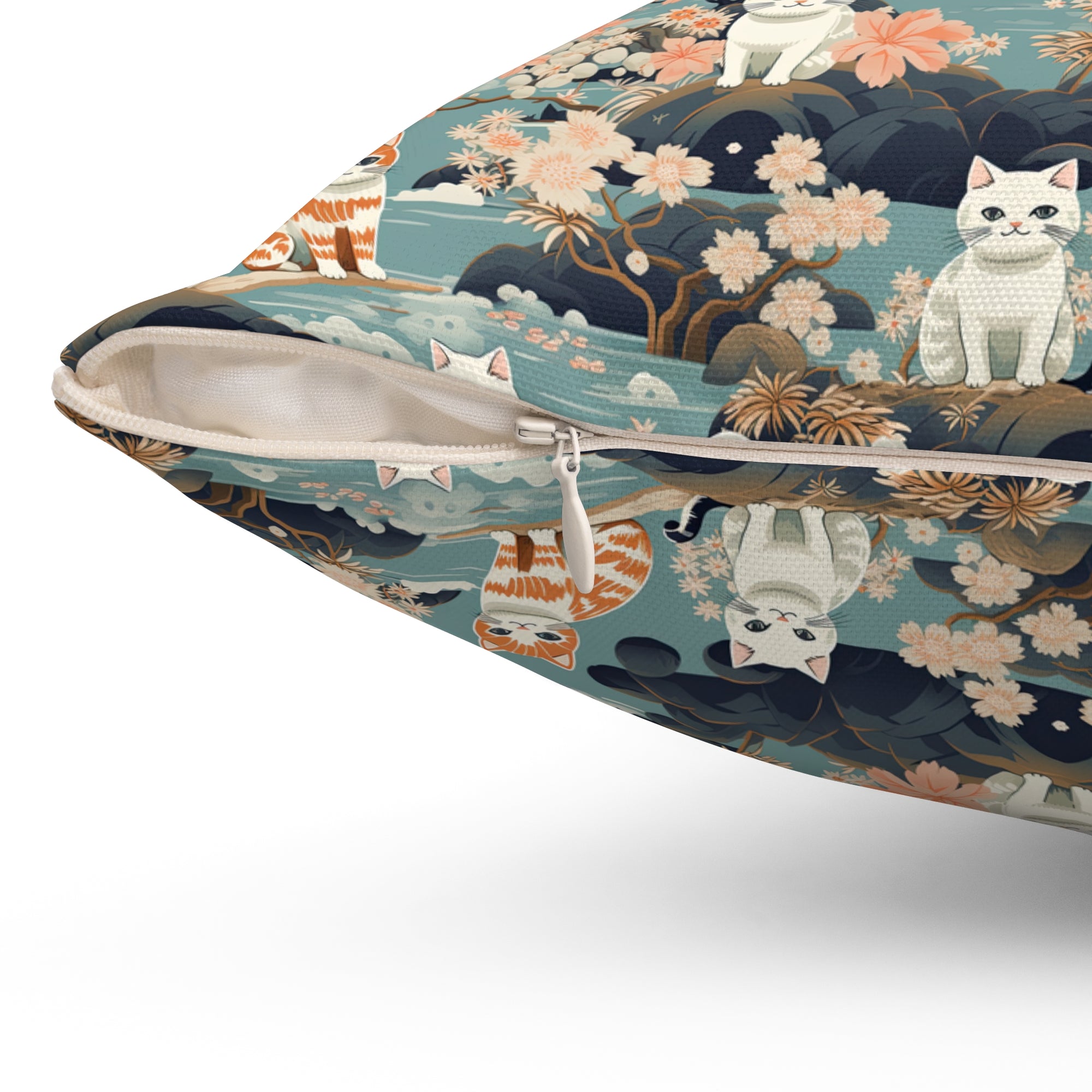 Indoor Square Pillow - A serene watercolor painting of fluffy cats lounging on rocks, surrounded by cherry blossoms and blue water, in a tranquil, nature-filled, Japanese-inspired landscape.