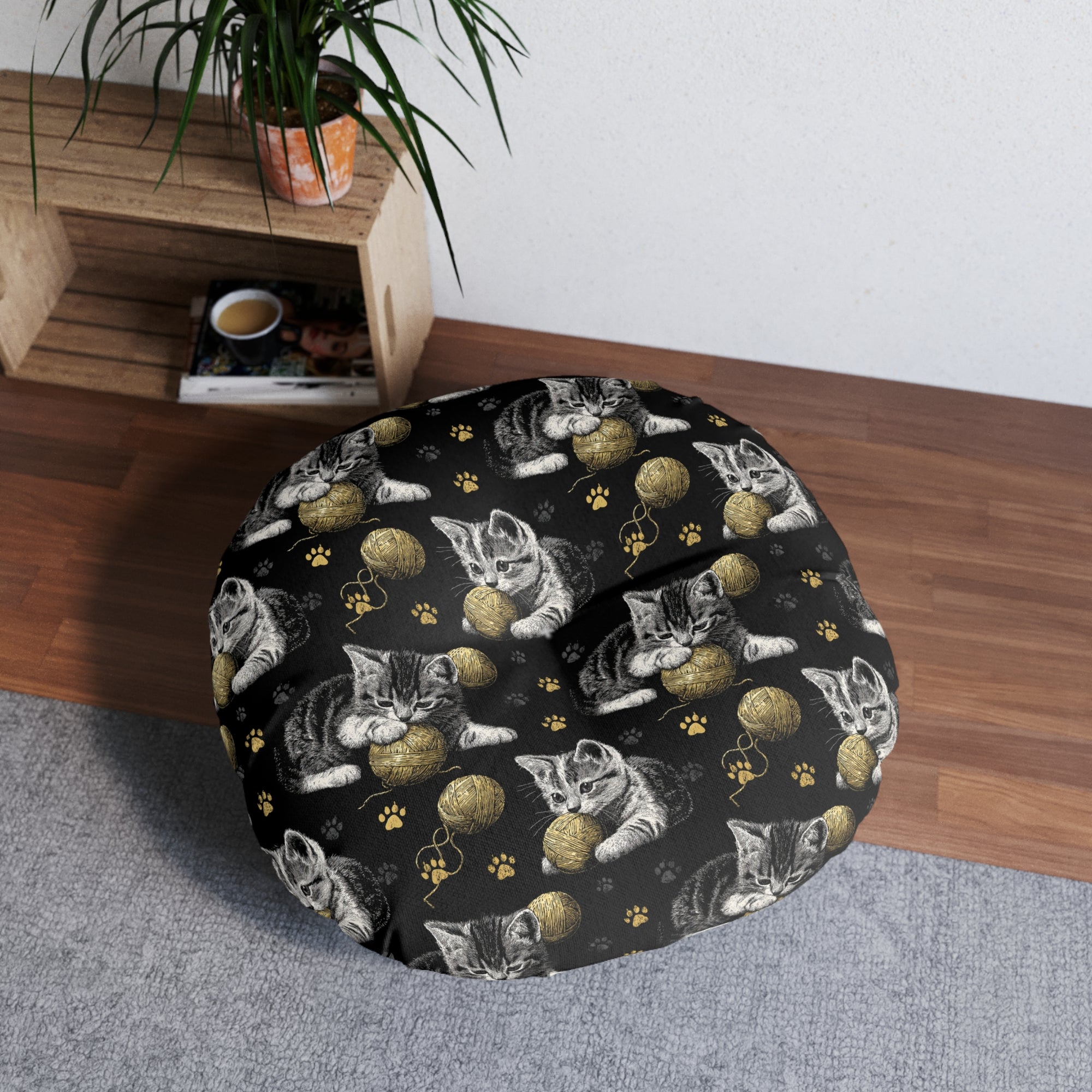 Indoor Round Floor Pillow - Grey and White Kittens Playing with Golden Yarn on a Black Background with Paw Prints