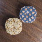 Indoor Round Floor Pillow - Adorable ginger cat with bright green eyes, sparkling gold yarn and paw prints, classic tabby cat illustration, cream background, cute and charming pet themed art