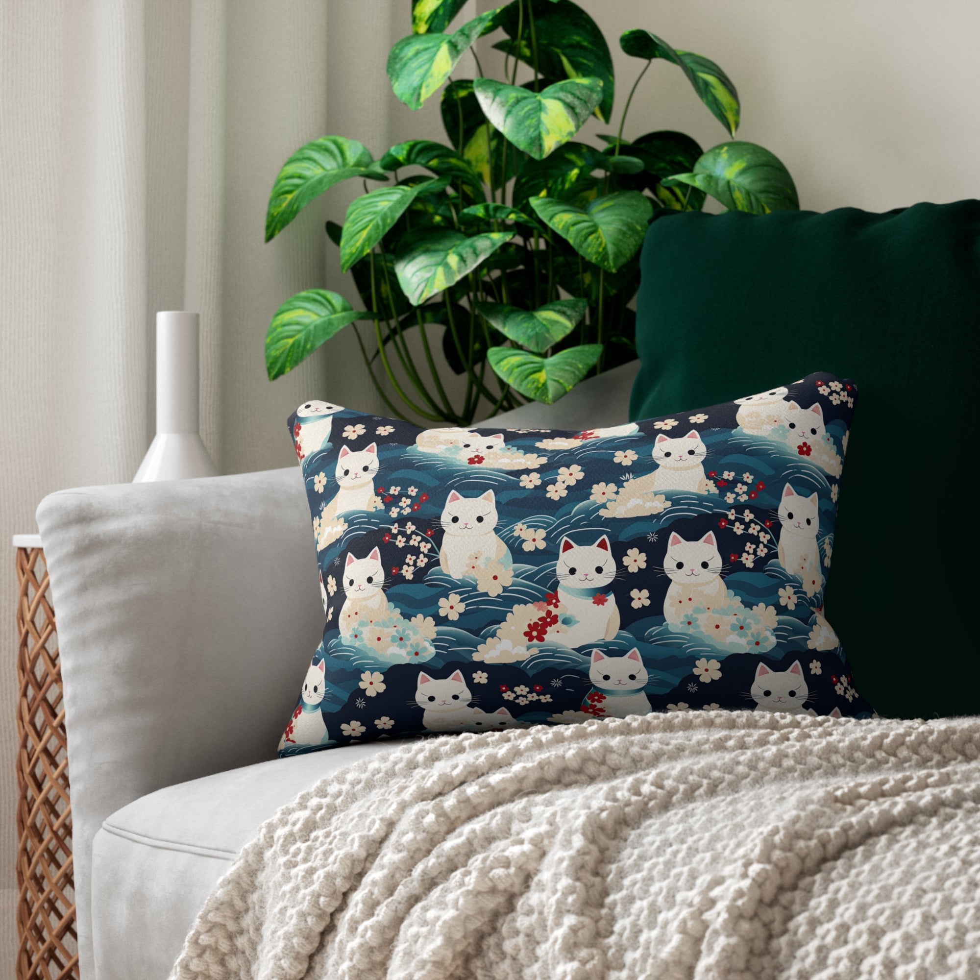 Indoor Lumbar Pillow - A lovely, playful, Japanese-inspired illustration of sweet white cats sitting on rolling blue waves with red and white flowers and gentle clouds.