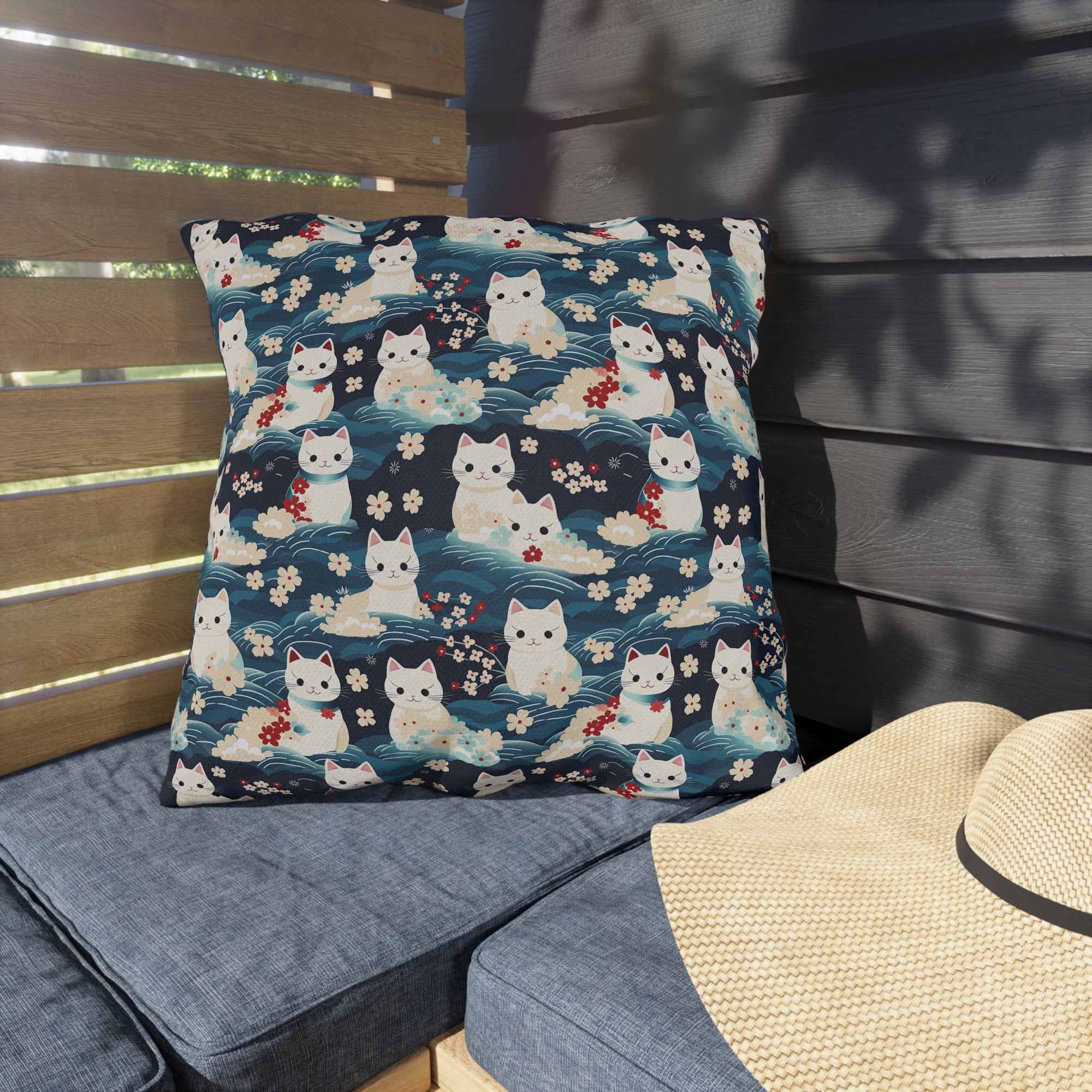 Outdoor Pillow - A lovely, playful, Japanese-inspired illustration of sweet white cats sitting on rolling blue waves with red and white flowers and gentle clouds.