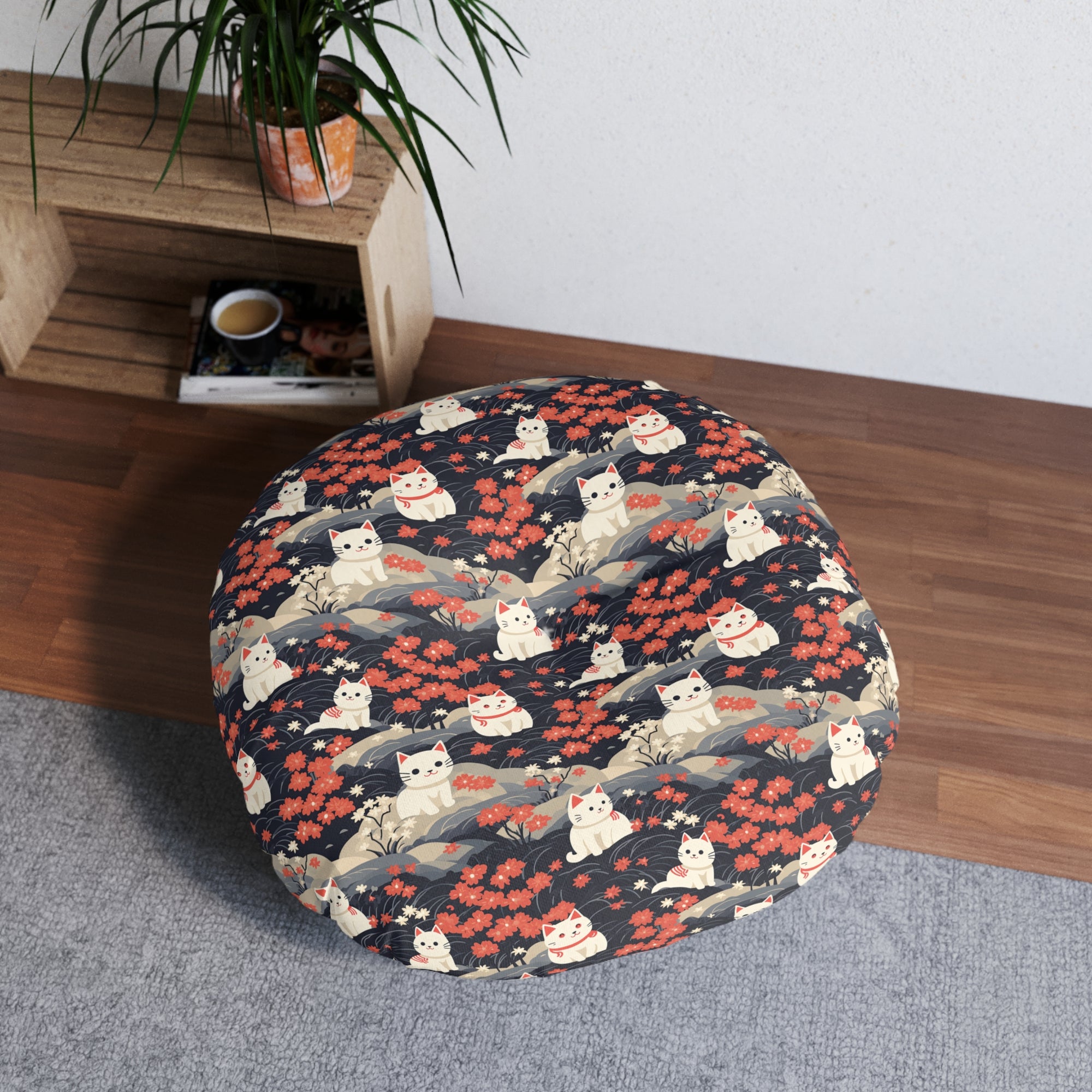 Indoor Round Floor Pillow - A charming, minimalist, Japanese-style illustration of cute white cats sitting amongst vibrant red and white flowers on a dark background.