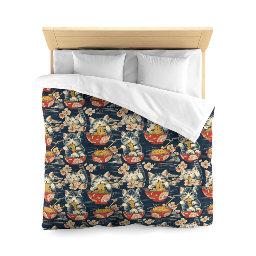Duvet Cover - A charming and detailed illustration of happy kittens in red ramen bowls eating their noodles with chopsticks among beautiful pink cherry blossoms on a dark background.