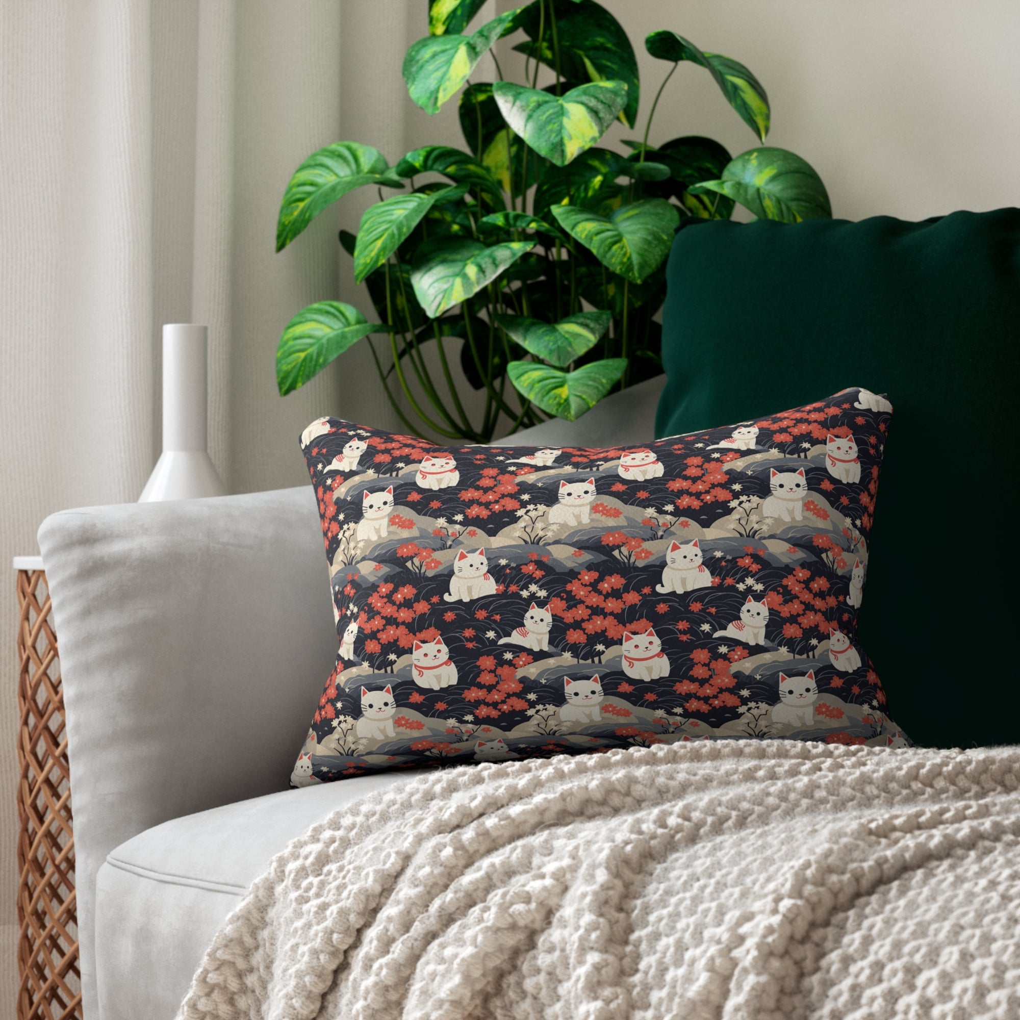 Indoor Lumbar Pillow - A charming, minimalist, Japanese-style illustration of cute white cats sitting amongst vibrant red and white flowers on a dark background.