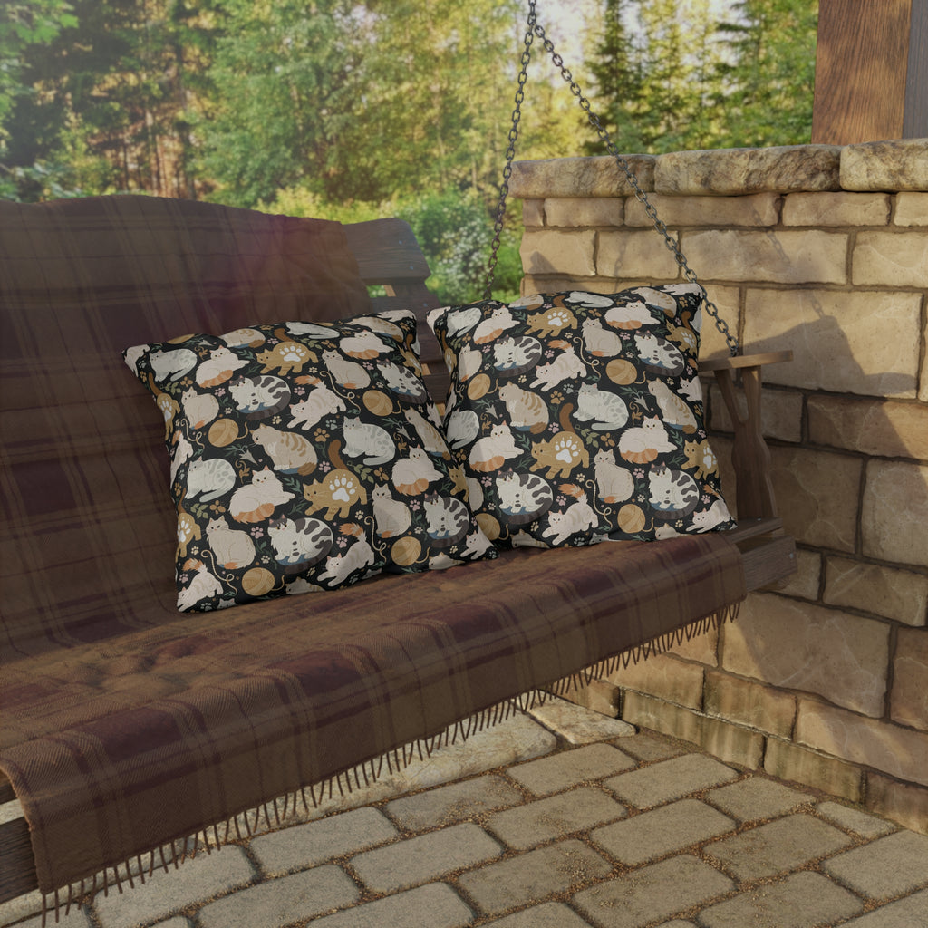 Outdoor Pillow - Diverse cats and kittens in a dark garden, various breeds and colors, soft natural tones with foliage and paw prints, charming animal illustration, dark background, gentle pet themed art