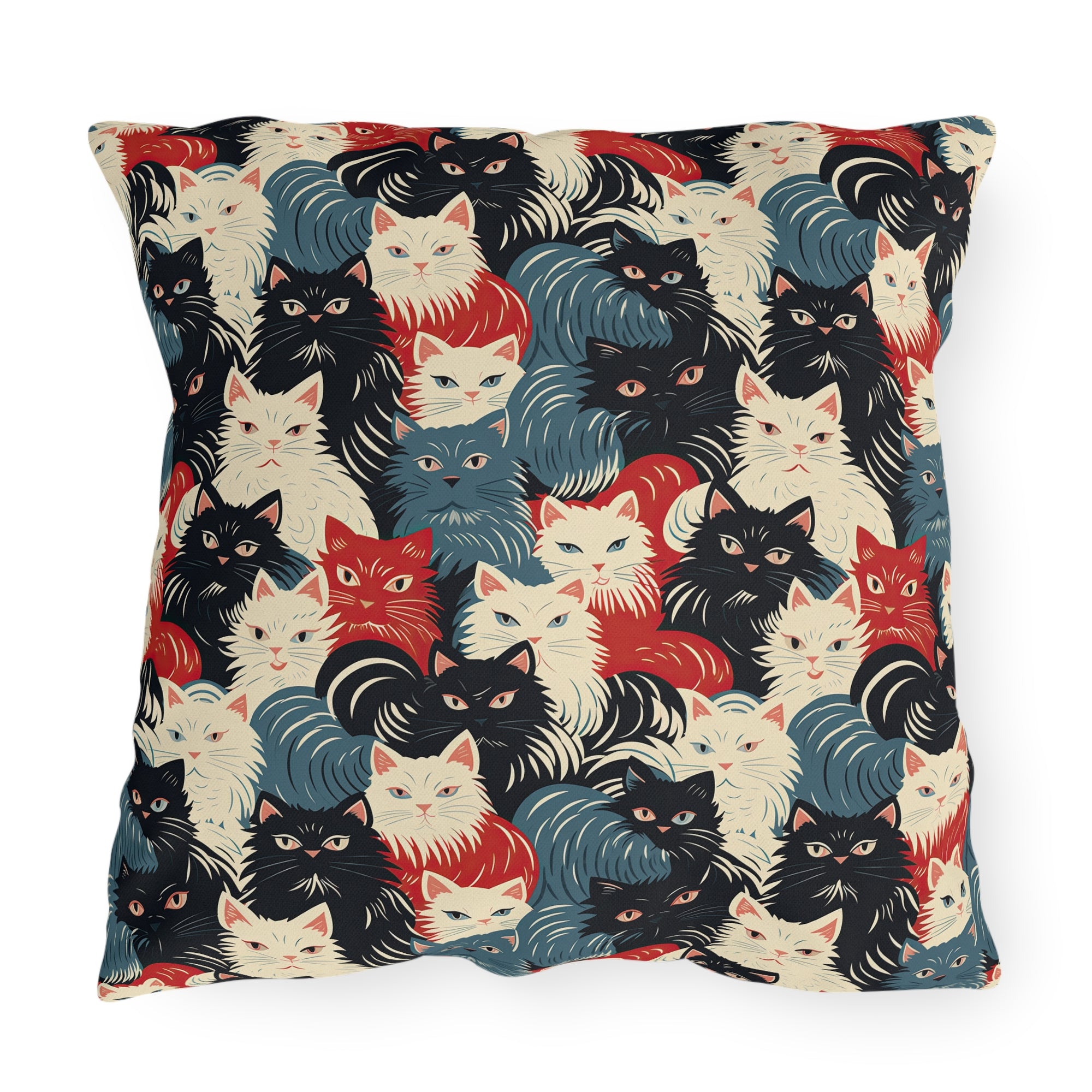 Outdoor Pillow - A bold and graphic pop art style illustration featuring a tight-knit cluster of various fluffy felines in black, white, red, and blue.