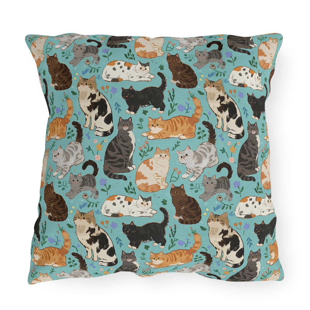 Outdoor Pillow - A Delightful Assortment of Charming Cats in Diverse Poses and Breeds Scattered Across a Soft Blue Floral Background