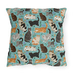 Outdoor Pillow - A Delightful Assortment of Charming Cats in Diverse Poses and Breeds Scattered Across a Soft Blue Floral Background