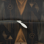 Indoor Lumbar Pillow - A striking and sophisticated Art Deco-style pattern of felines with bold, intricate lines and dramatic geometric shapes, all rendered in a unique gold and gray color palette.