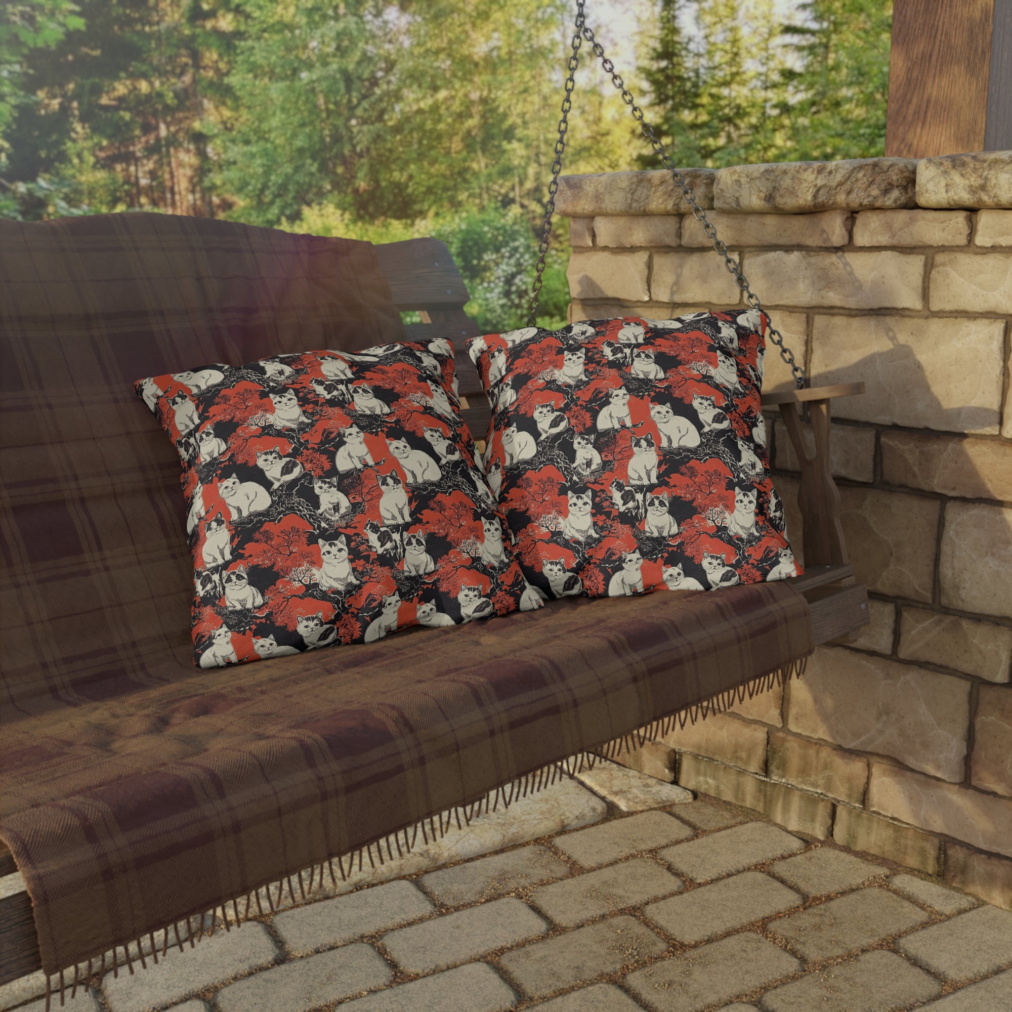 Outdoor Pillow - A striking black-and-white illustration with red accents of charming cats perched on the branches of trees in a beautiful Japanese woodblock print style.