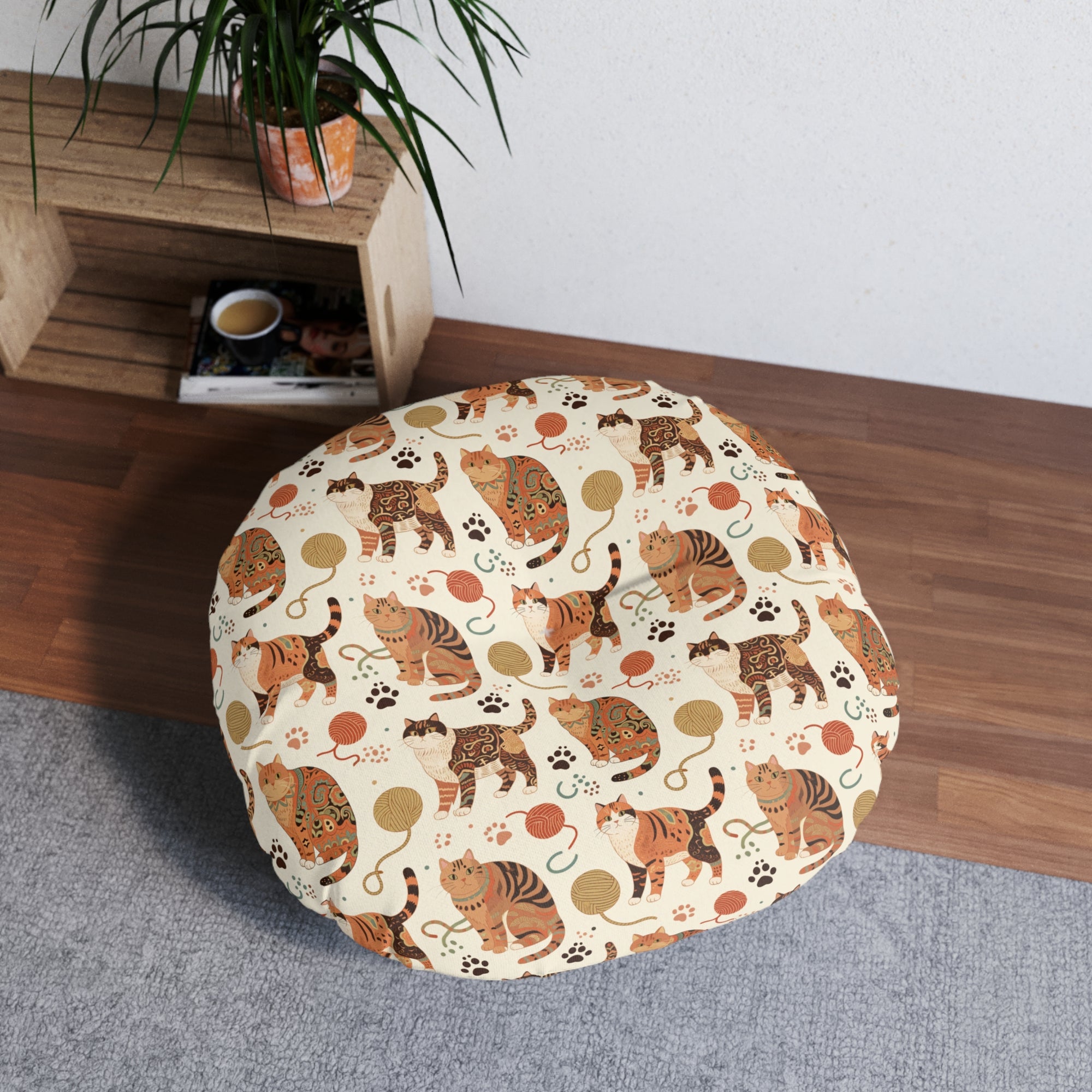 Indoor Round Floor Pillow - Artistic patterned cats in warm earth tones, unique tribal and folk art designs, playful felines with yarn and paw prints, bohemian animal print, cream background, creative cat art