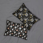 Indoor Lumbar Pillow - Grey and White Kittens Playing with Golden Yarn on a Black Background with Paw Prints