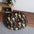 Indoor Round Floor Pillow - A bold and striking Art Deco pattern showcasing stylized feline portraits with sharp, gold lines and geometric shapes set against a dark, dramatic background.