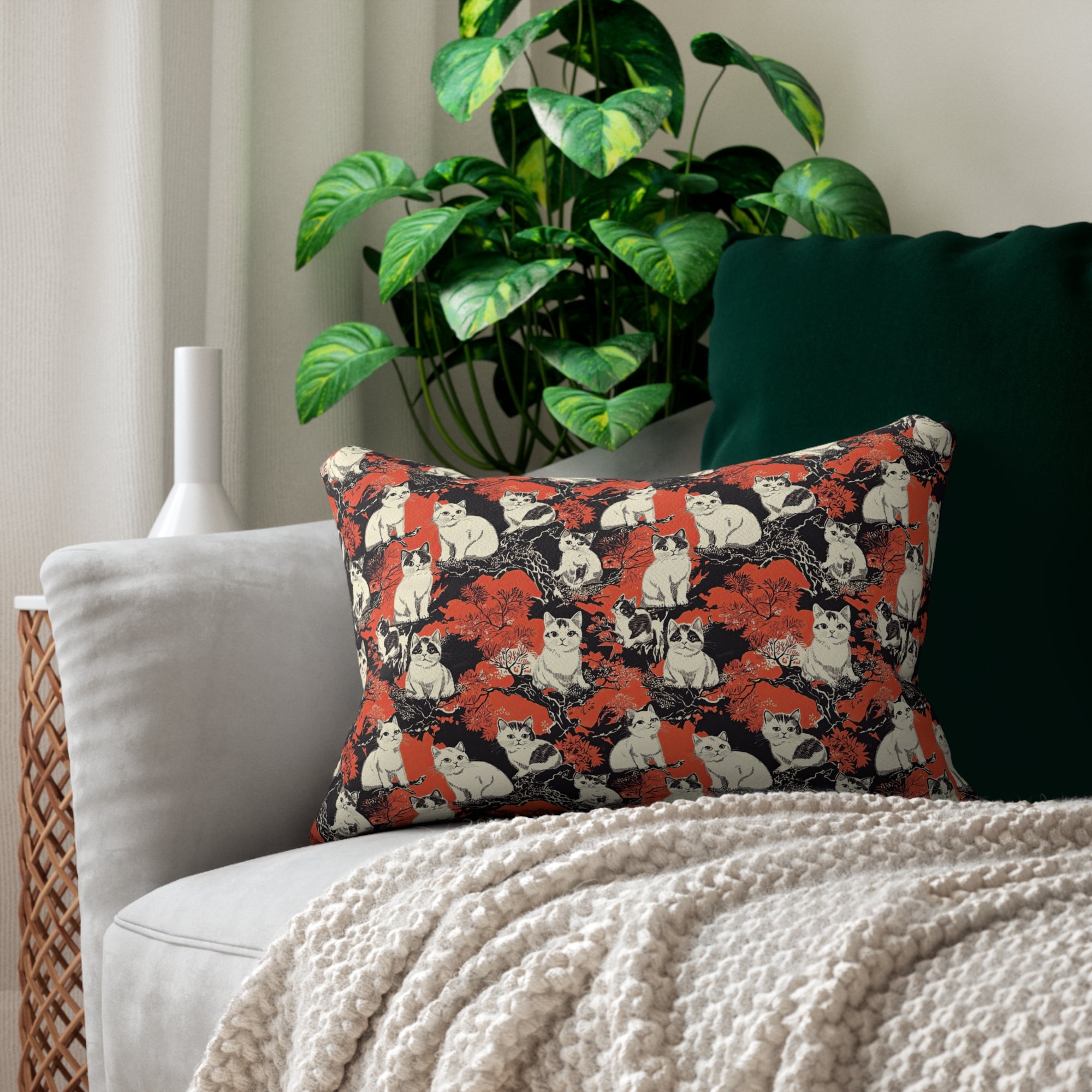 Indoor Lumbar Pillow - A striking black-and-white illustration with red accents of charming cats perched on the branches of trees in a beautiful Japanese woodblock print style.