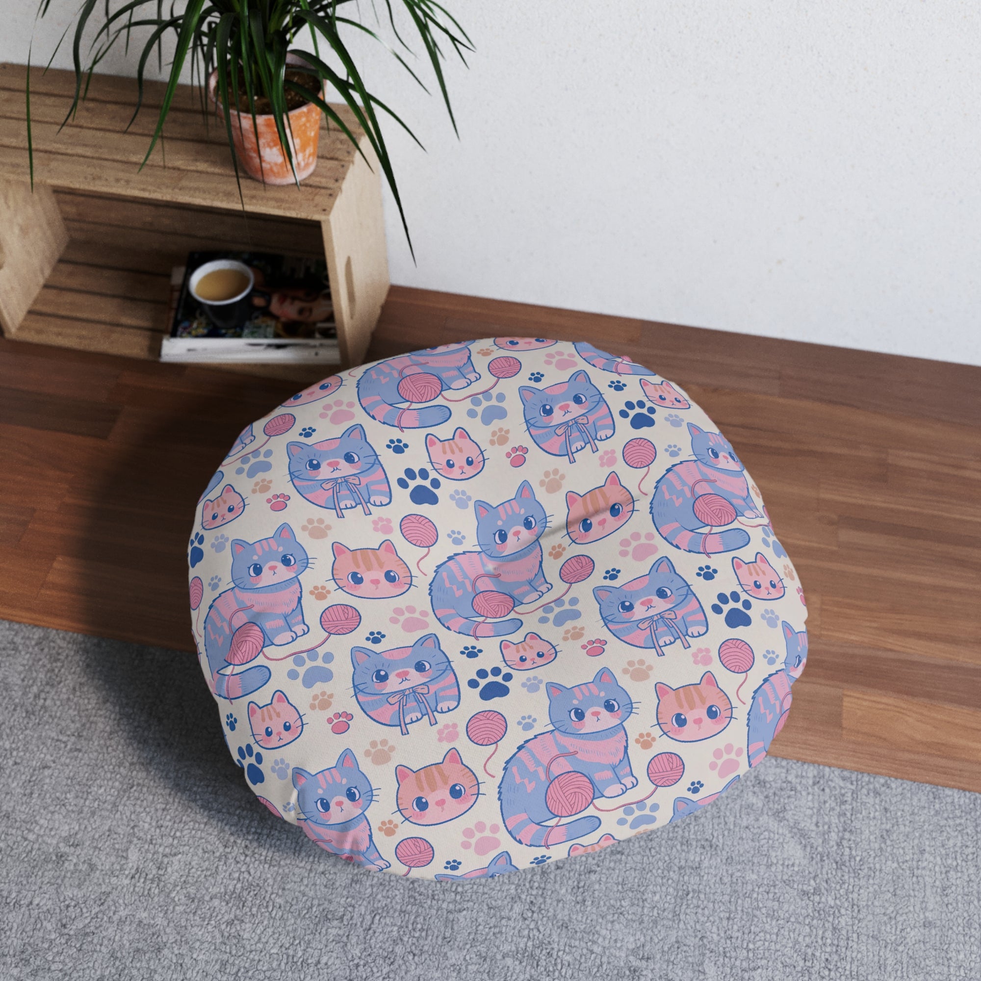 Indoor Round Floor Pillow - Sweet pastel blue and pink cartoon cats, cute kawaii style kittens with yarn and paw prints, charming and playful animal design, light cream background, delightful pet pattern