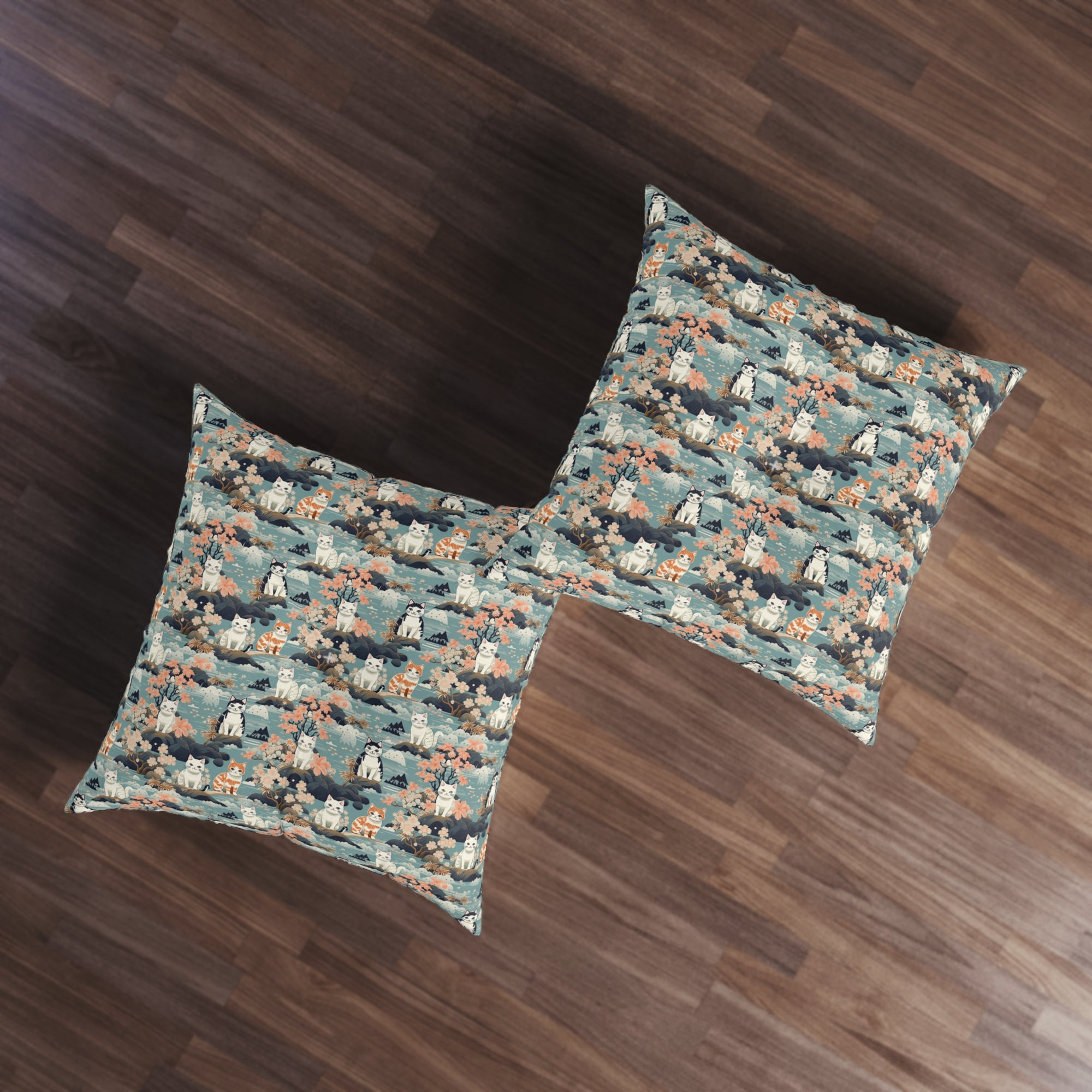 Indoor Square Floor Pillow - A serene watercolor painting of fluffy cats lounging on rocks, surrounded by cherry blossoms and blue water, in a tranquil, nature-filled, Japanese-inspired landscape.