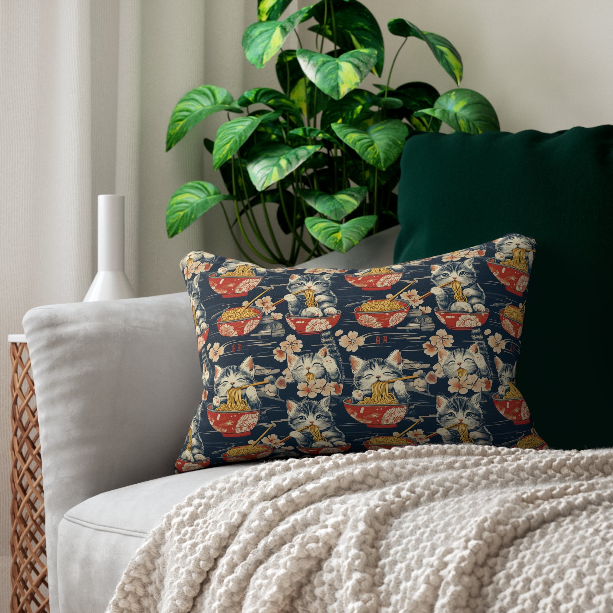 Indoor Lumbar Pillow - A charming and detailed illustration of happy kittens in red ramen bowls eating their noodles with chopsticks among beautiful pink cherry blossoms on a dark background.