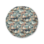 Indoor Round Floor Pillow - A serene watercolor painting of fluffy cats lounging on rocks, surrounded by cherry blossoms and blue water, in a tranquil, nature-filled, Japanese-inspired landscape.