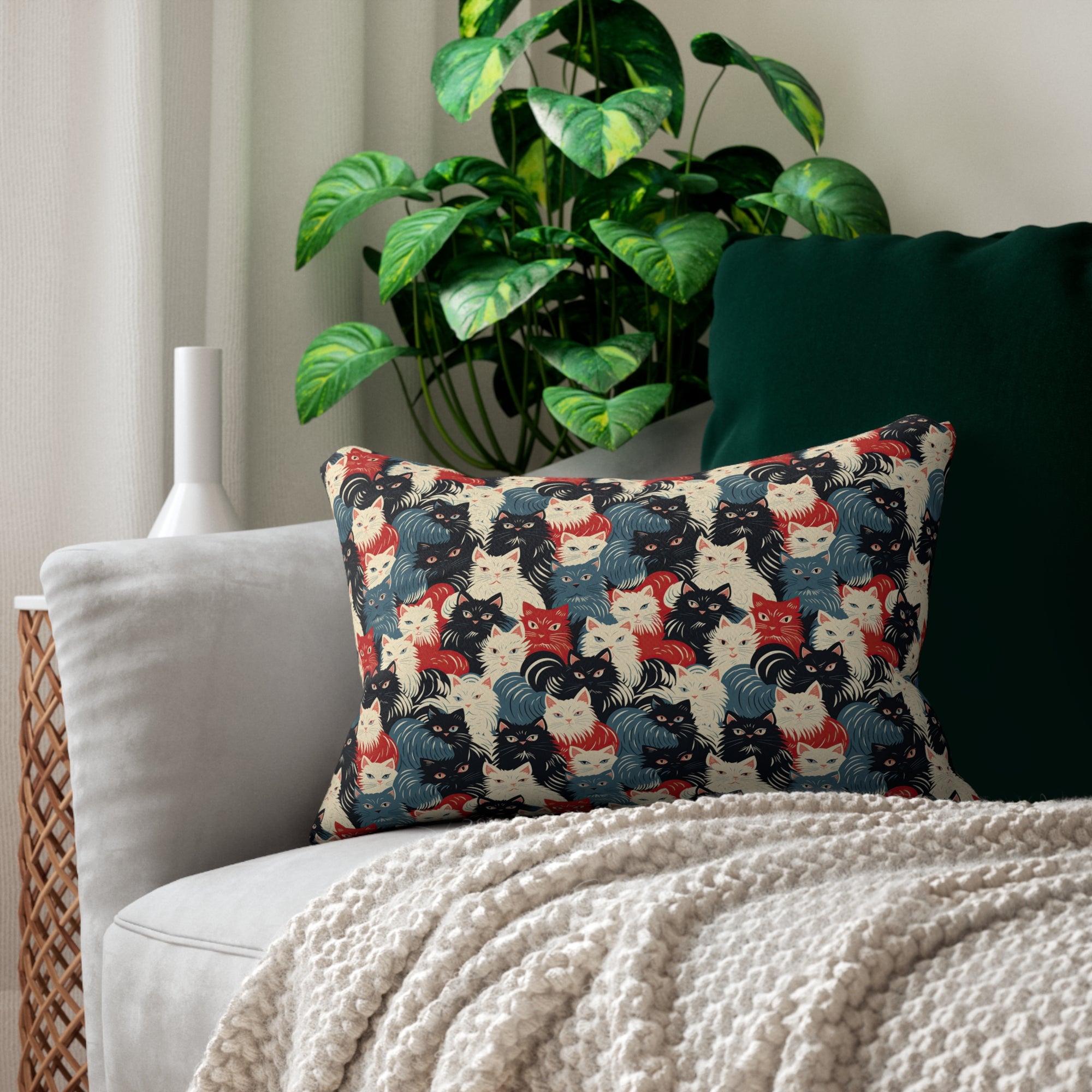 Indoor Lumbar Pillow - A bold and graphic pop art style illustration featuring a tight-knit cluster of various fluffy felines in black, white, red, and blue.
