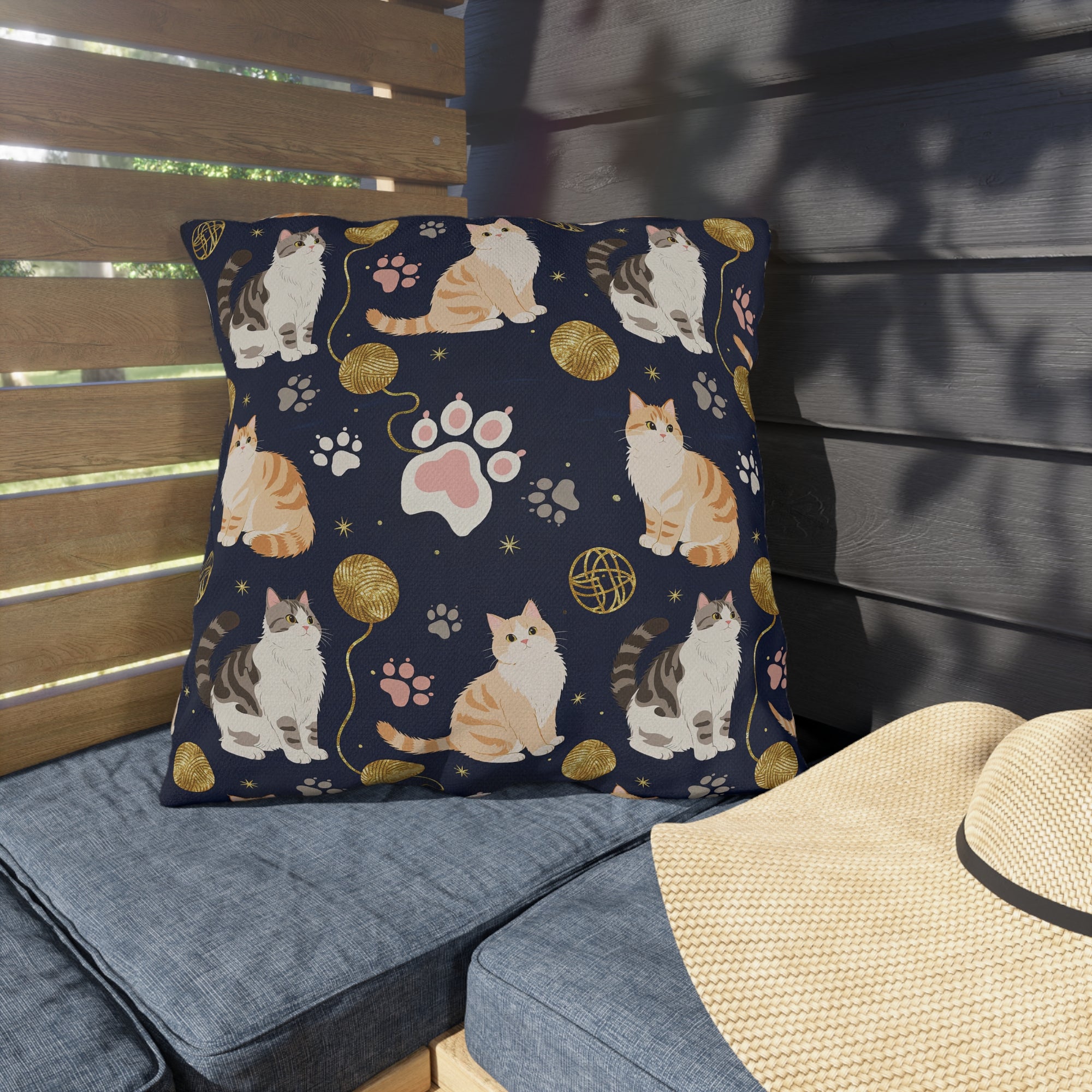 Outdoor Pillow - Charming cats and golden yarn playful design, cute kittens with paw prints, whimsical animal art for cat lovers, dark blue background, delightful pet themed illustration