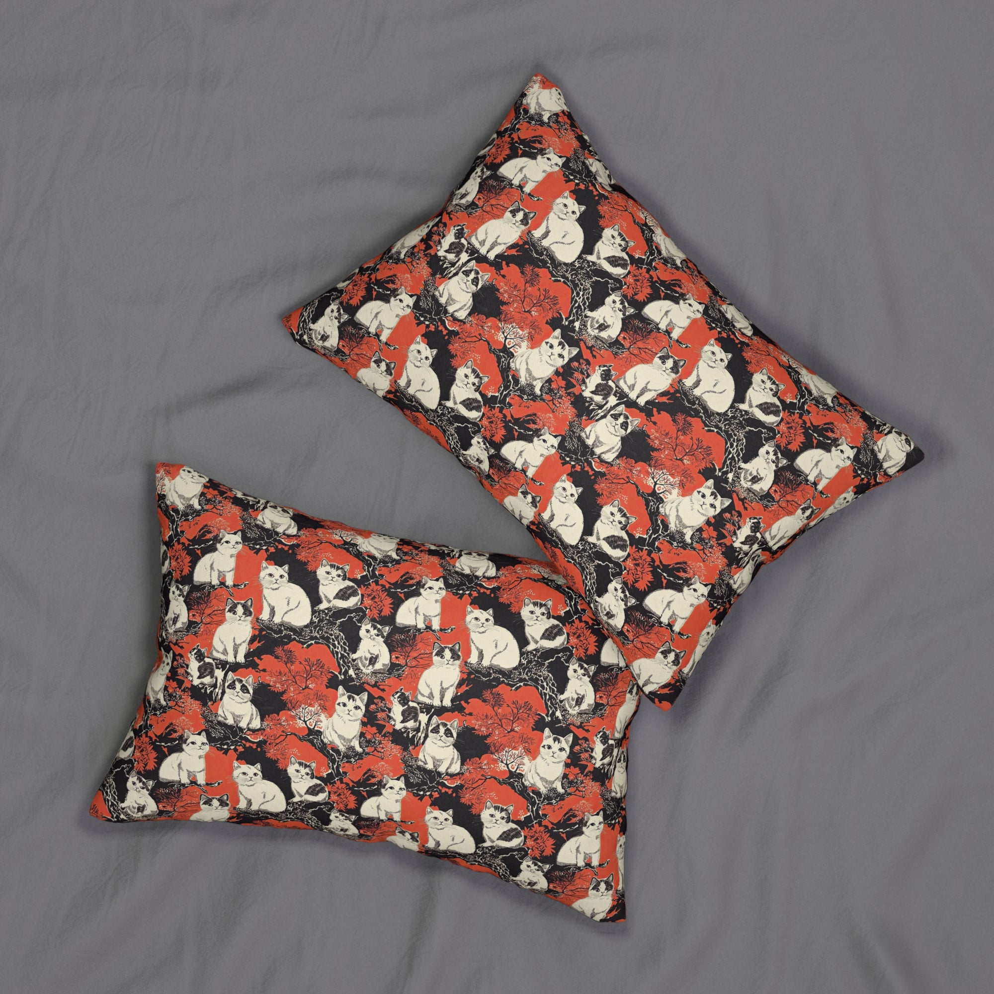 Indoor Lumbar Pillow - A striking black-and-white illustration with red accents of charming cats perched on the branches of trees in a beautiful Japanese woodblock print style.