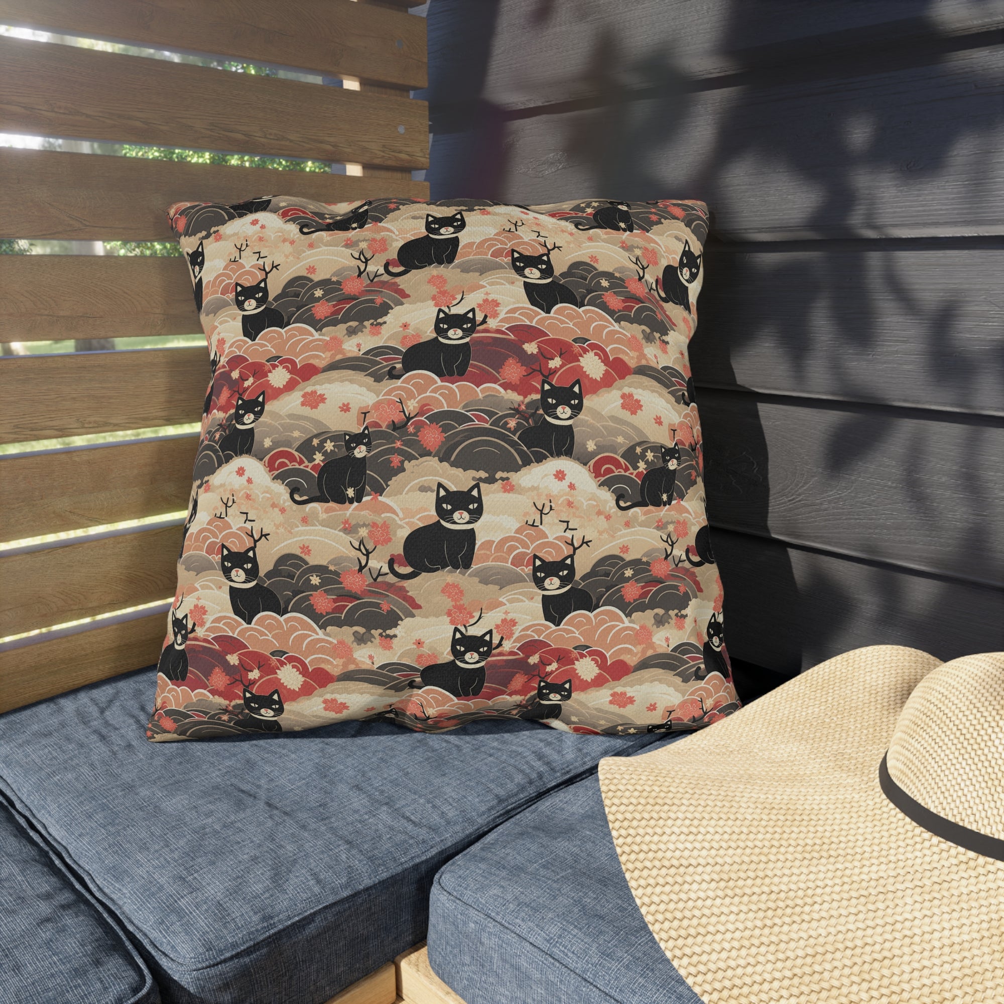 Outdoor Pillow - A whimsical and enchanting Japanese-style pattern featuring cute black and orange cats nestled among vibrant orange blossoms and soft, cloudy backgrounds.
