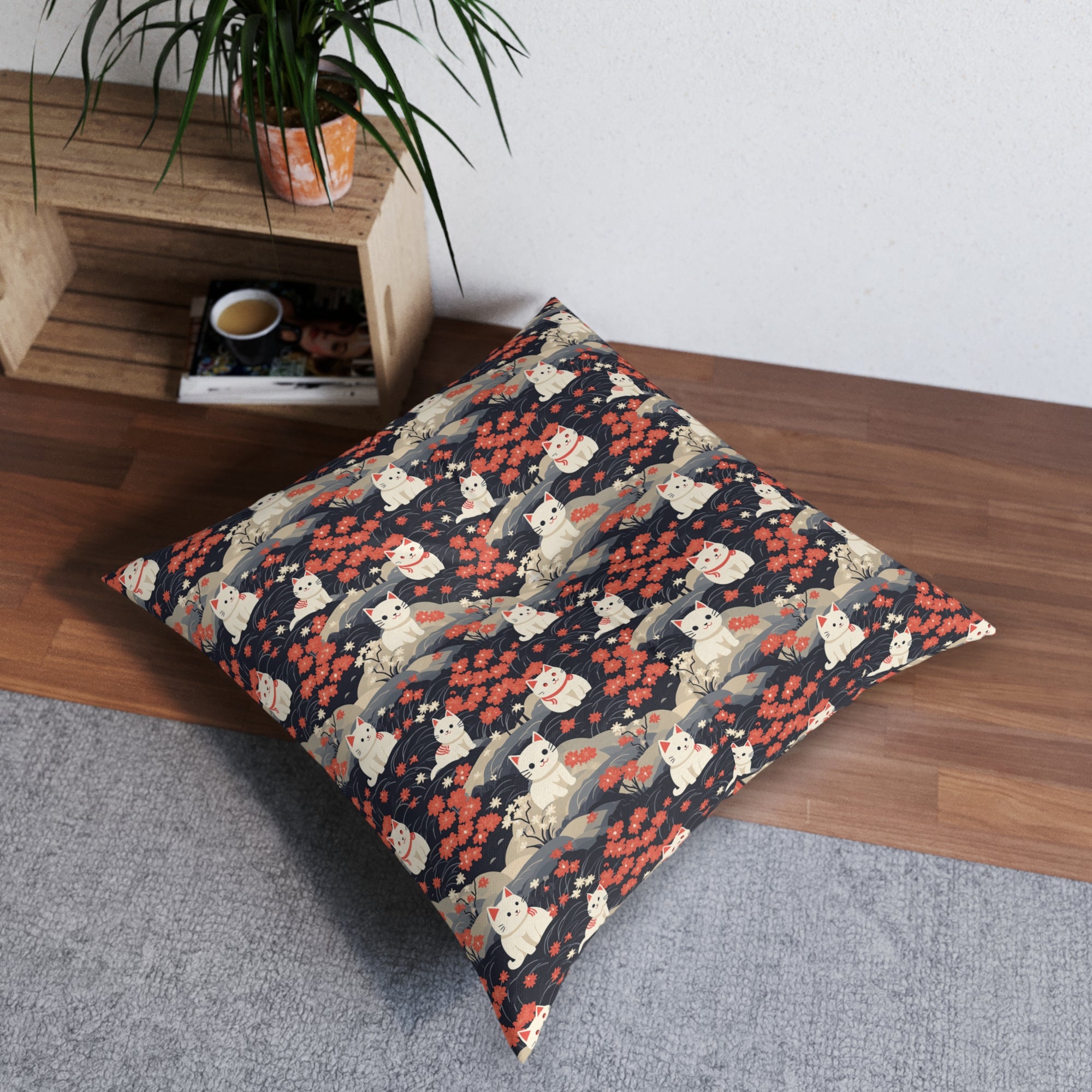 Indoor Square Floor Pillow - A charming, minimalist, Japanese-style illustration of cute white cats sitting amongst vibrant red and white flowers on a dark background.