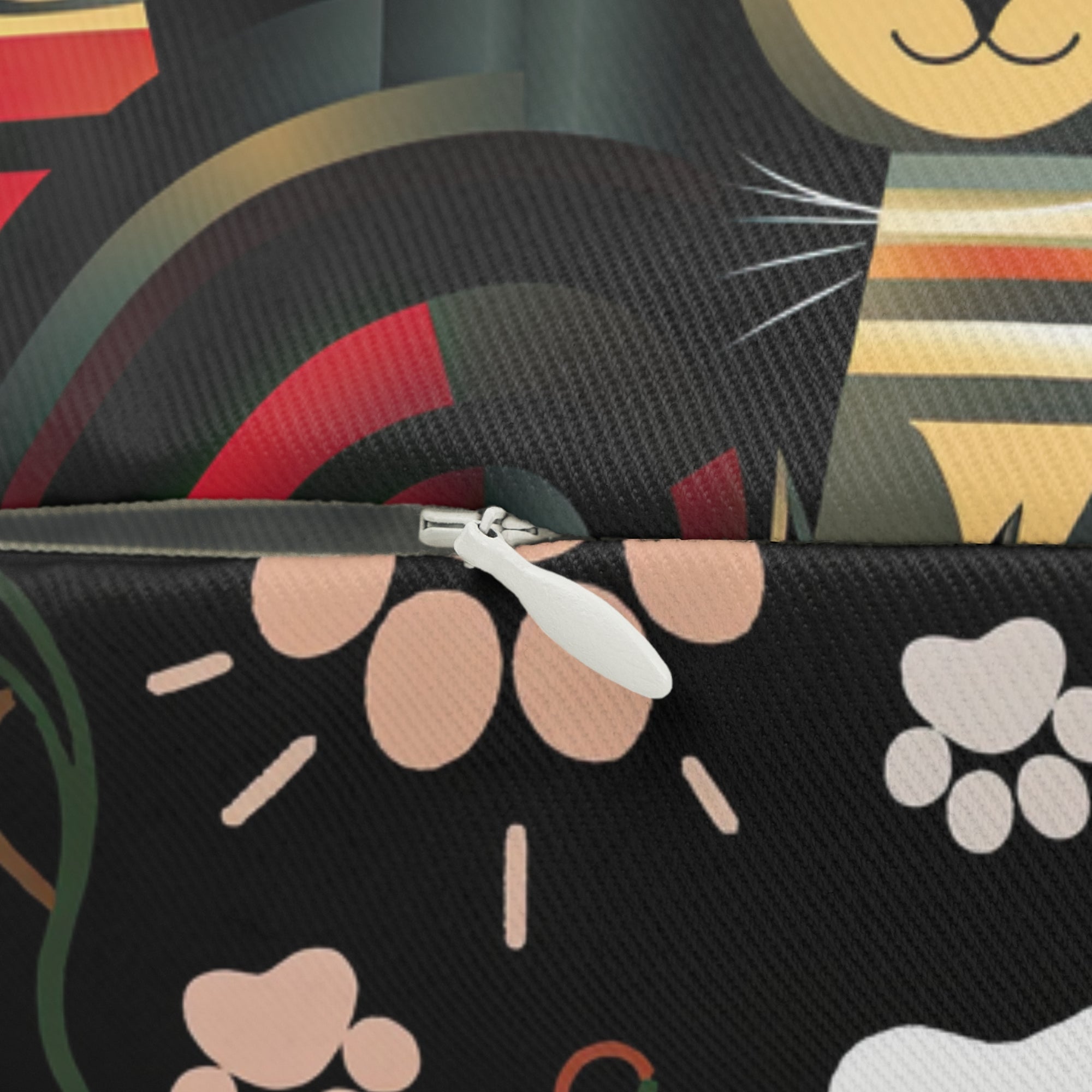 Indoor Lumbar Pillow - A bold and striking Art Deco pattern showcasing stylized feline portraits with sharp, gold lines and geometric shapes set against a dark, dramatic background.