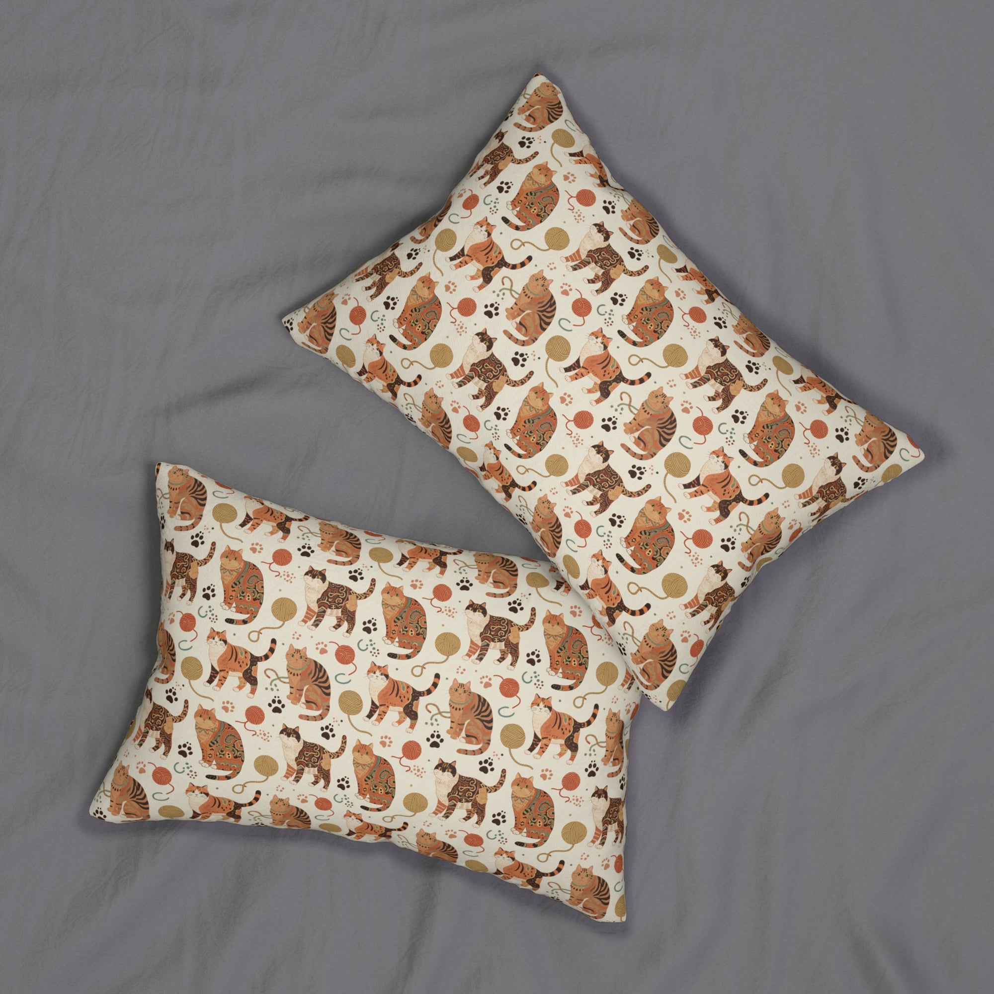 Indoor Lumbar Pillow - Artistic patterned cats in warm earth tones, unique tribal and folk art designs, playful felines with yarn and paw prints, bohemian animal print, cream background, creative cat art