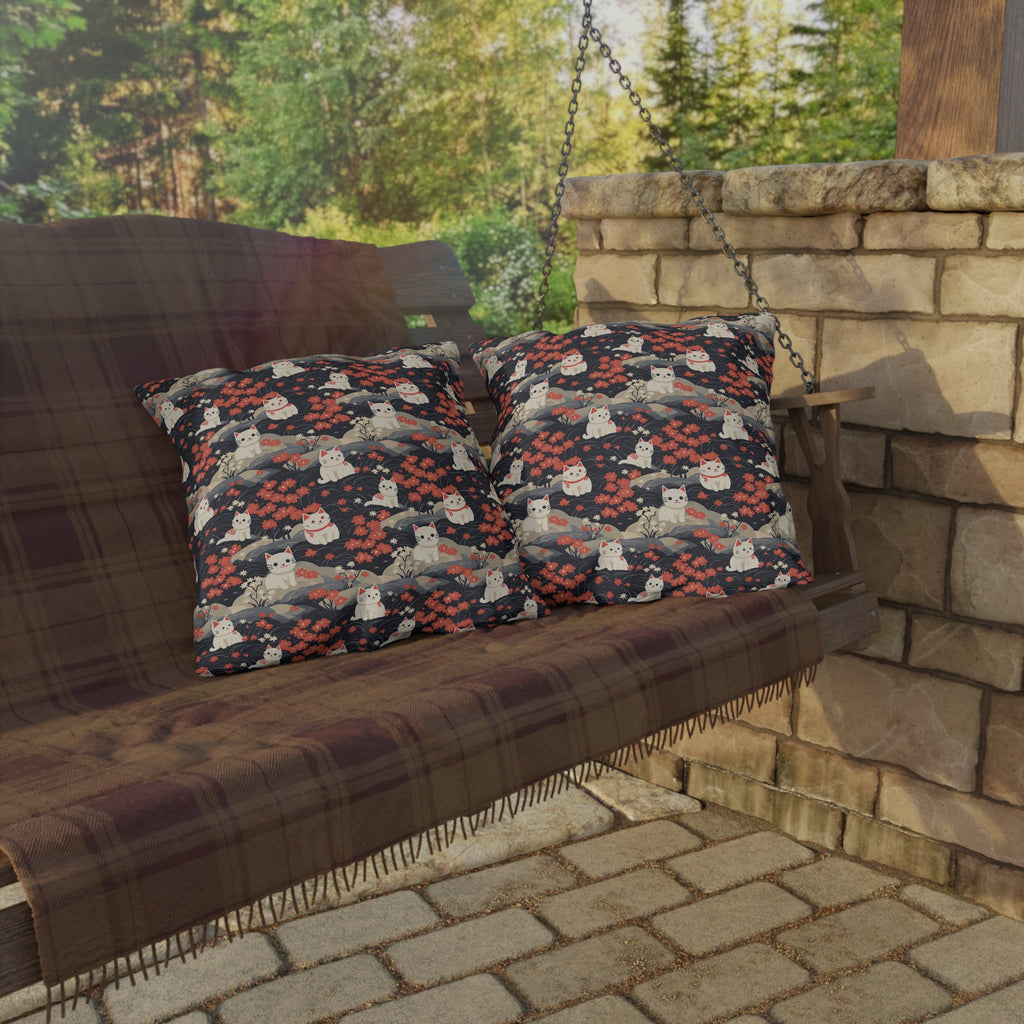 Outdoor Pillow - A charming, minimalist, Japanese-style illustration of cute white cats sitting amongst vibrant red and white flowers on a dark background.