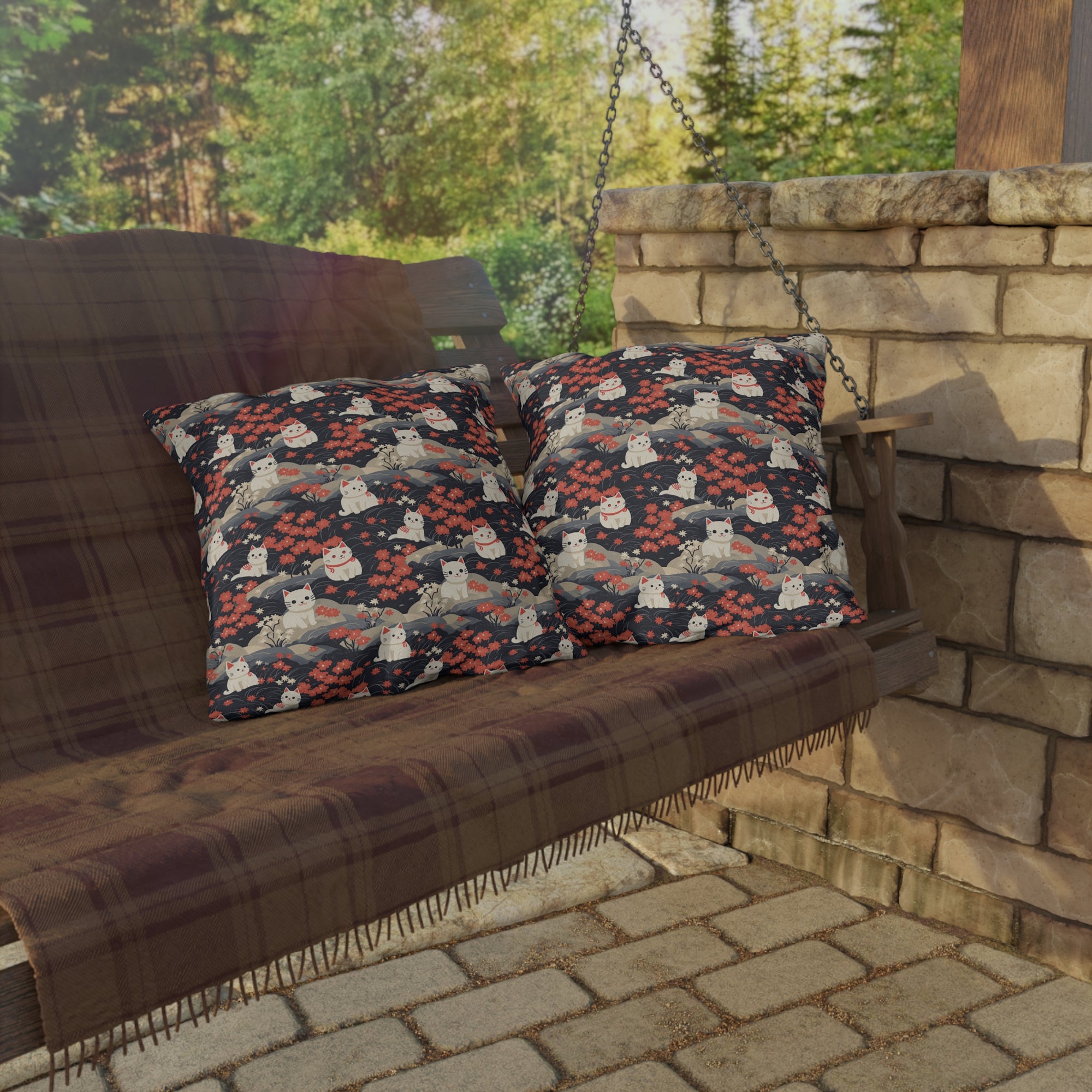 Outdoor Pillow - A charming, minimalist, Japanese-style illustration of cute white cats sitting amongst vibrant red and white flowers on a dark background.