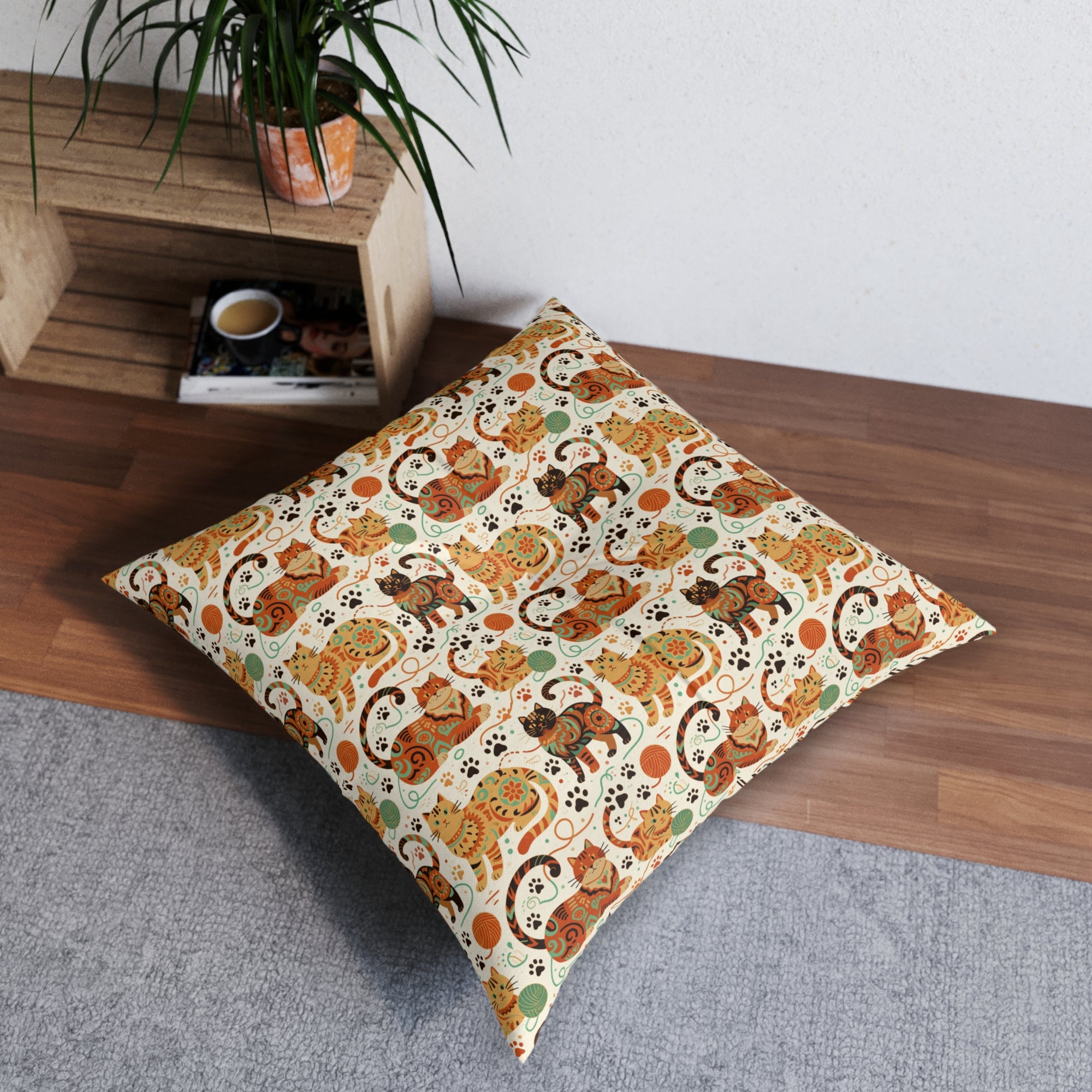 Indoor Square Floor Pillow - Colorful folk art patterned cats, vibrant orange and teal hues, playful felines with yarn and paw prints, bohemian animal illustration, cream background, artistic and cheerful design