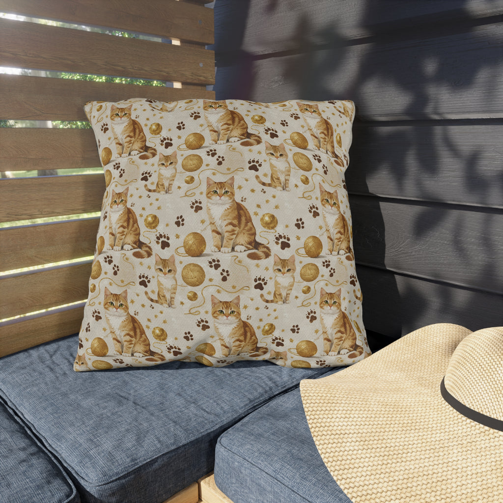 Outdoor Pillow - Adorable ginger cat with bright green eyes, sparkling gold yarn and paw prints, classic tabby cat illustration, cream background, cute and charming pet themed art