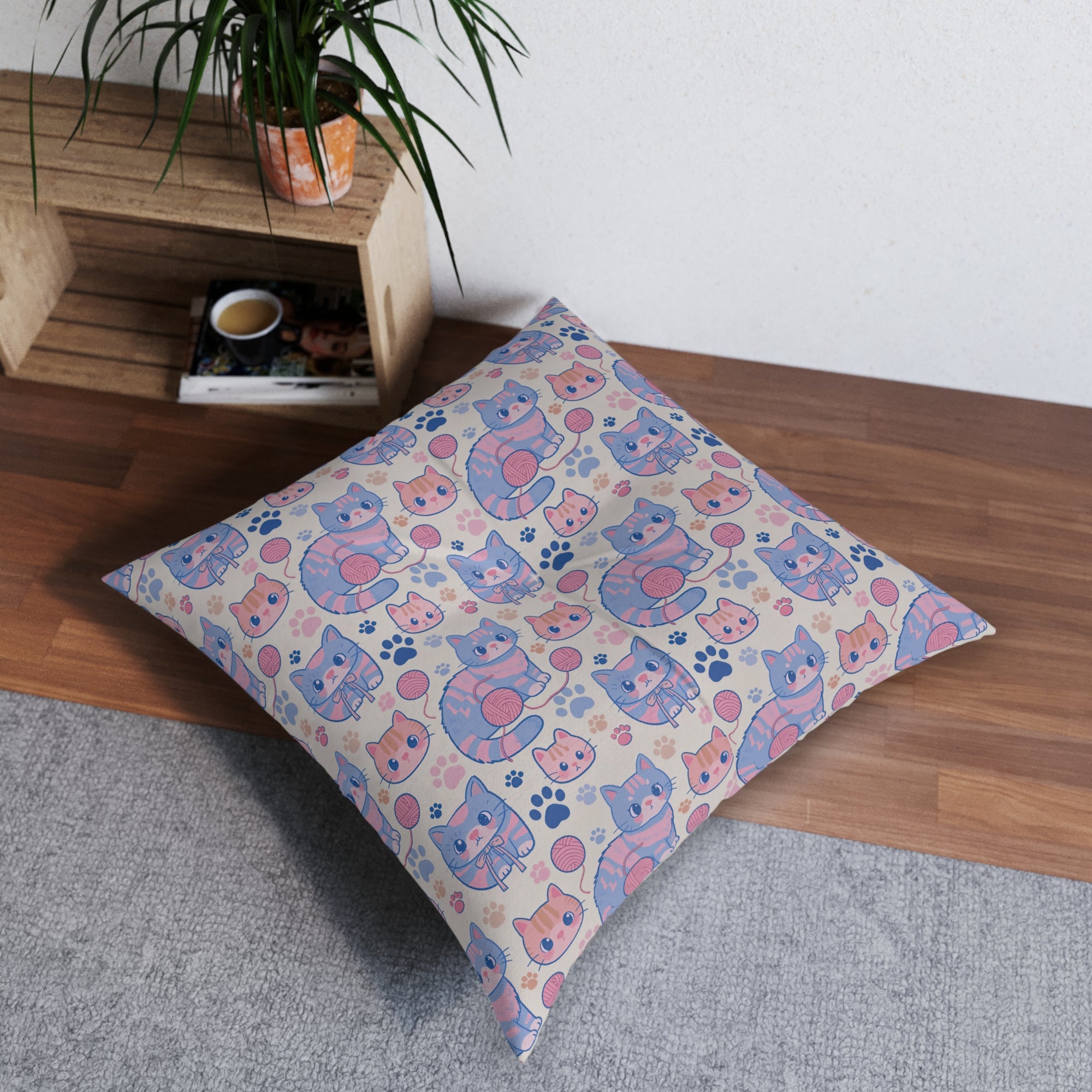 Indoor Square Floor Pillow - Sweet pastel blue and pink cartoon cats, cute kawaii style kittens with yarn and paw prints, charming and playful animal design, light cream background, delightful pet pattern
